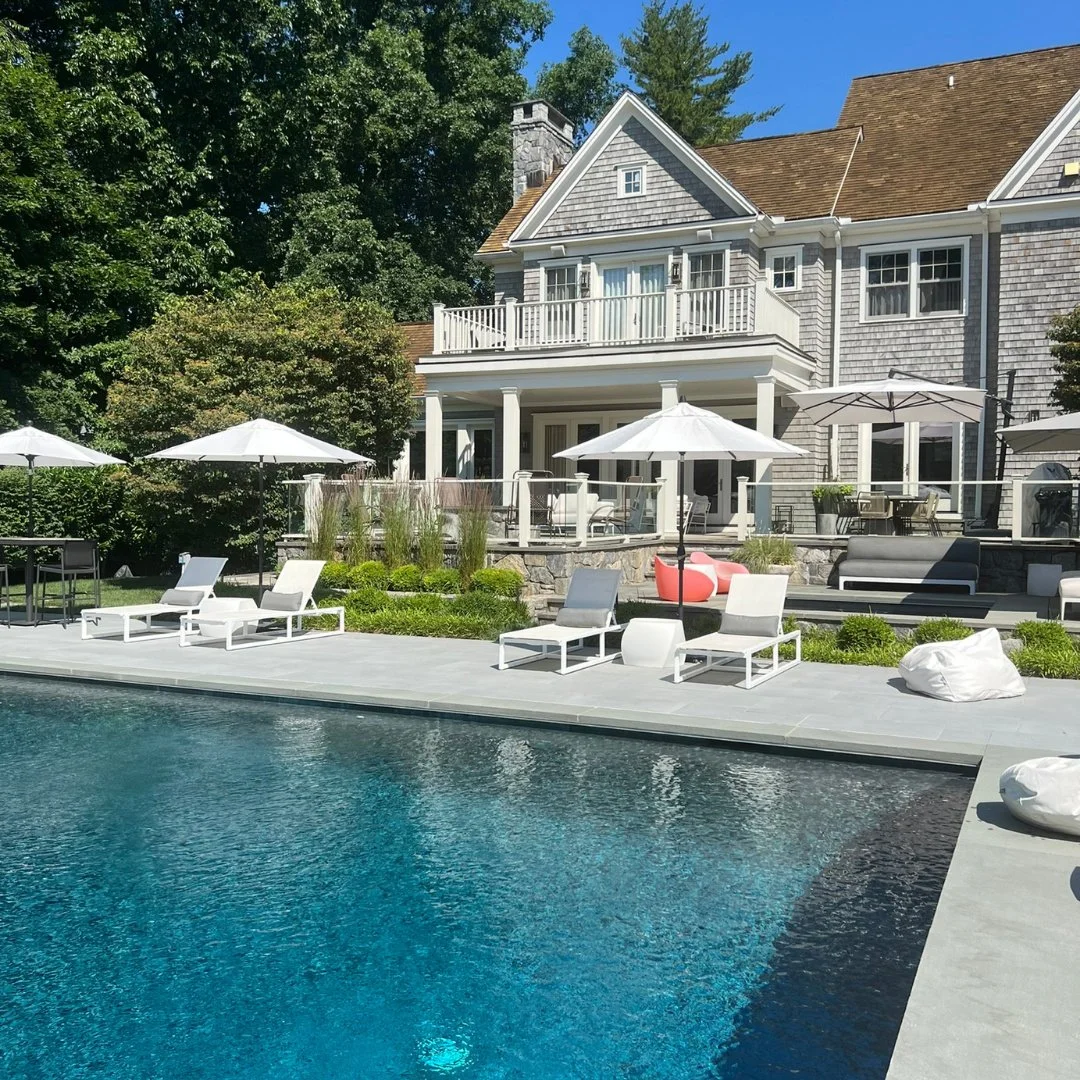 We're green with envy for the backyard bliss at this home! Porcelain pavers and bluestone allow the pool to shine.
