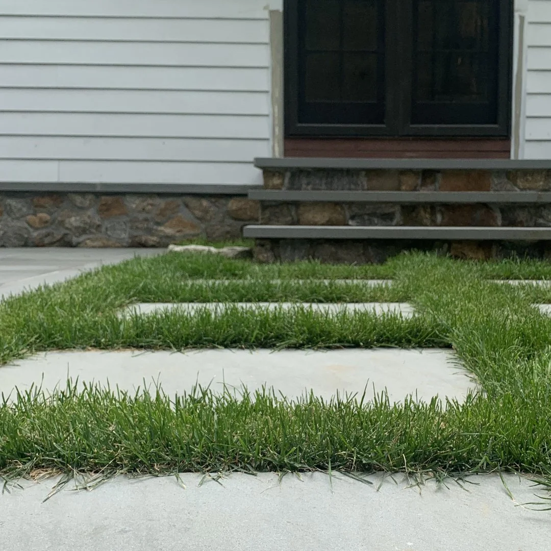 Grass joints are a great way to soften the edges of a hardscape design while improving drainage and reducing heat absorption on those hot summer days.
