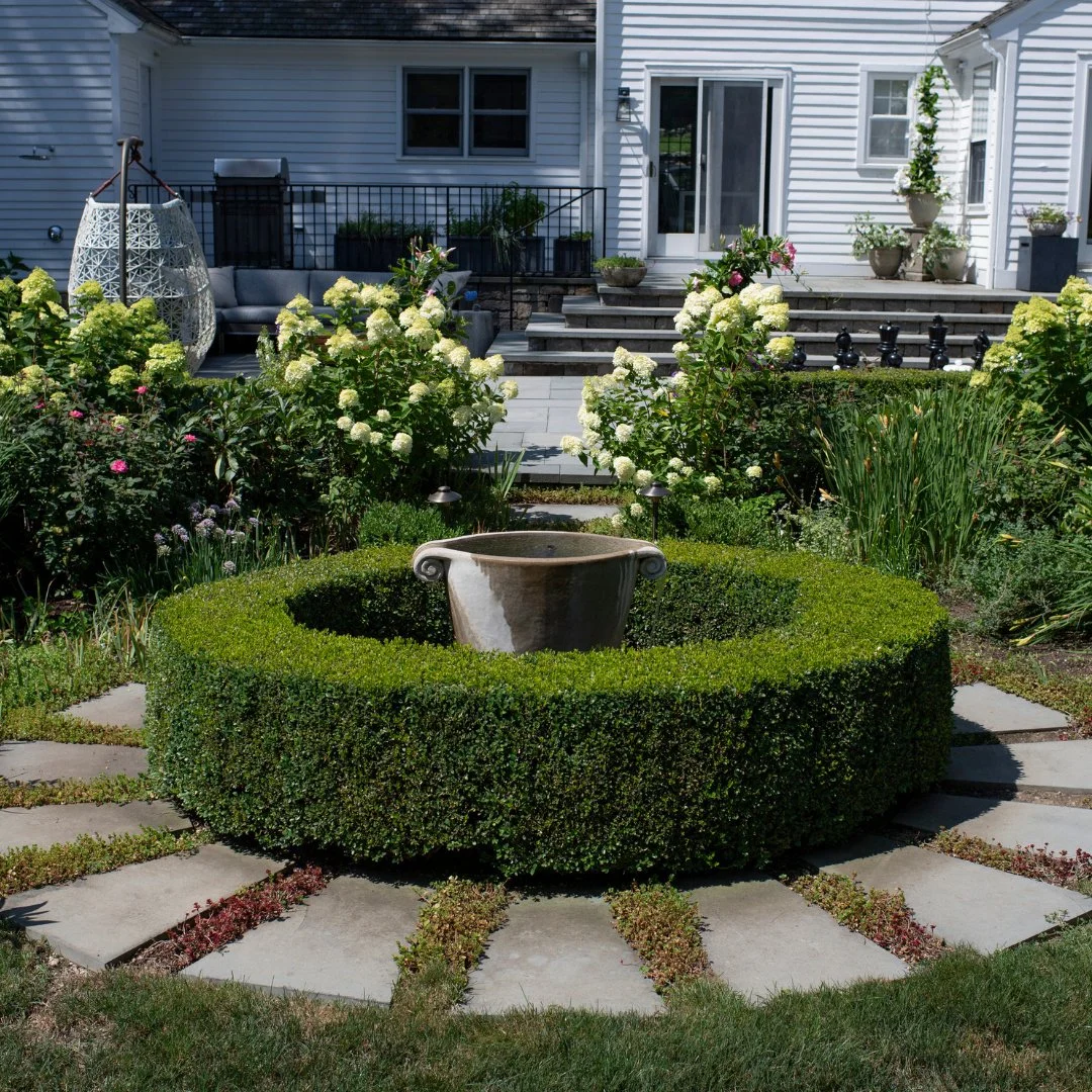 "And the secret garden bloomed and bloomed and every morning revealed new miracles."
This might not be a walled-in space like the novel, but how can walking past this fountain, reaching out to the hedgerows and flowers, not feel miraculous 