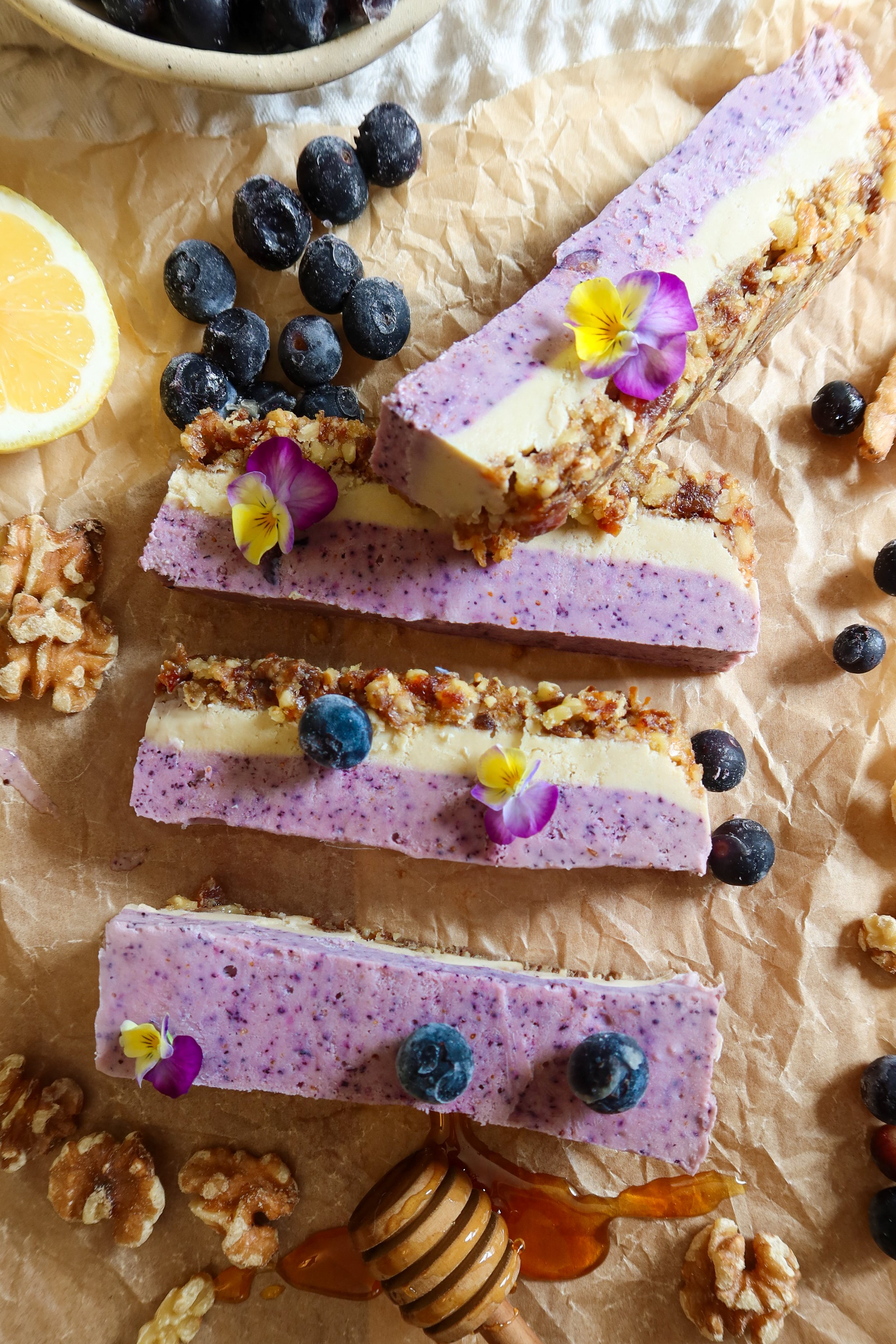 Swirled purple vegan cheesecake topped with blueberries