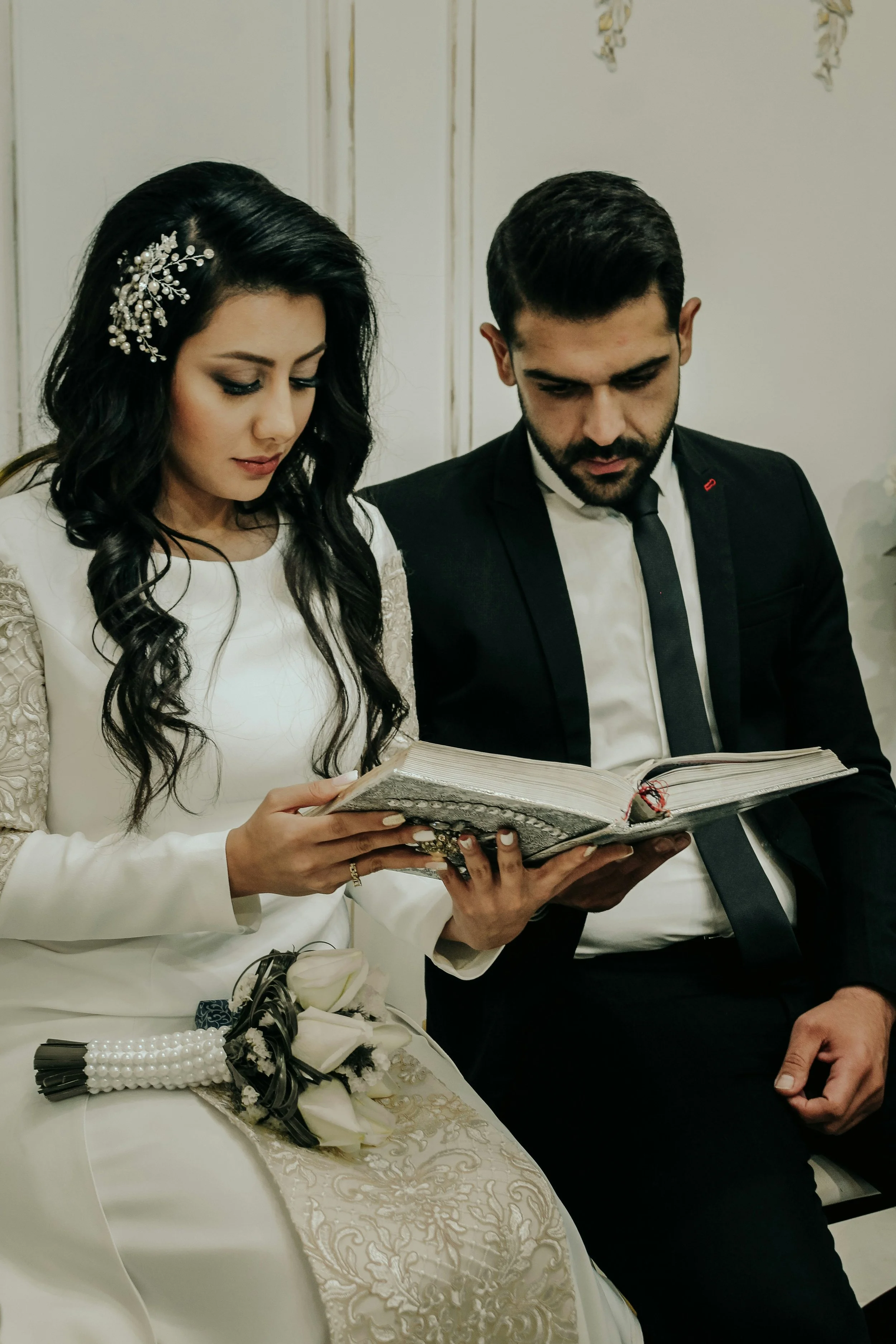 Couple reviewing options for a marriage counselor on a tablet