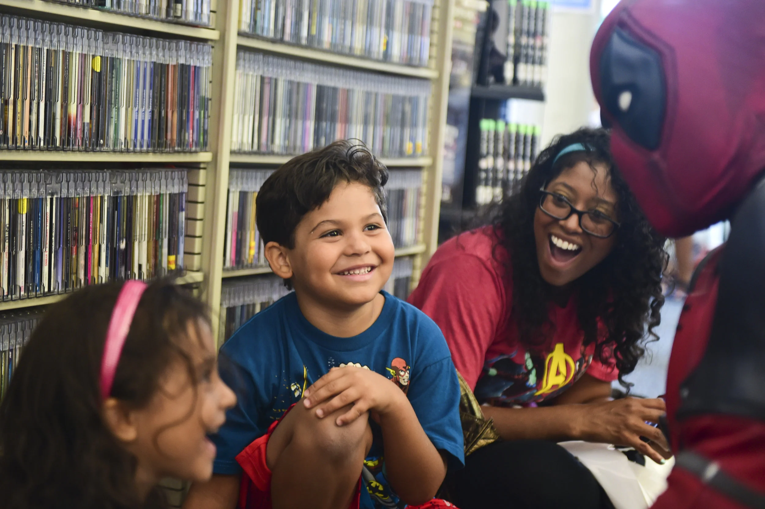  Jay Philip of Temple, dressed as Deadpool, talks with Melania Solis, 3, Adrian Solis, 5, and their mother Dialis Solis of Reading, during Comic Con at the Reading Public Library on July 14, 2018. 