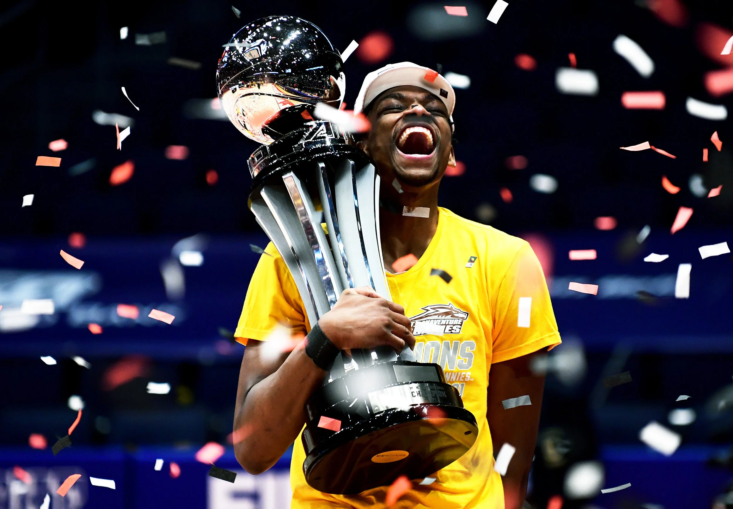  Osun Osunniyi #21 of the St. Bonaventure Bonnies celebrates with the championship trophy following their 74-65 win over the Virginia Commonwealth Rams in the championship game of the Atlantic 10 Men's Basketball Tournament at UD Arena on March 14, 2