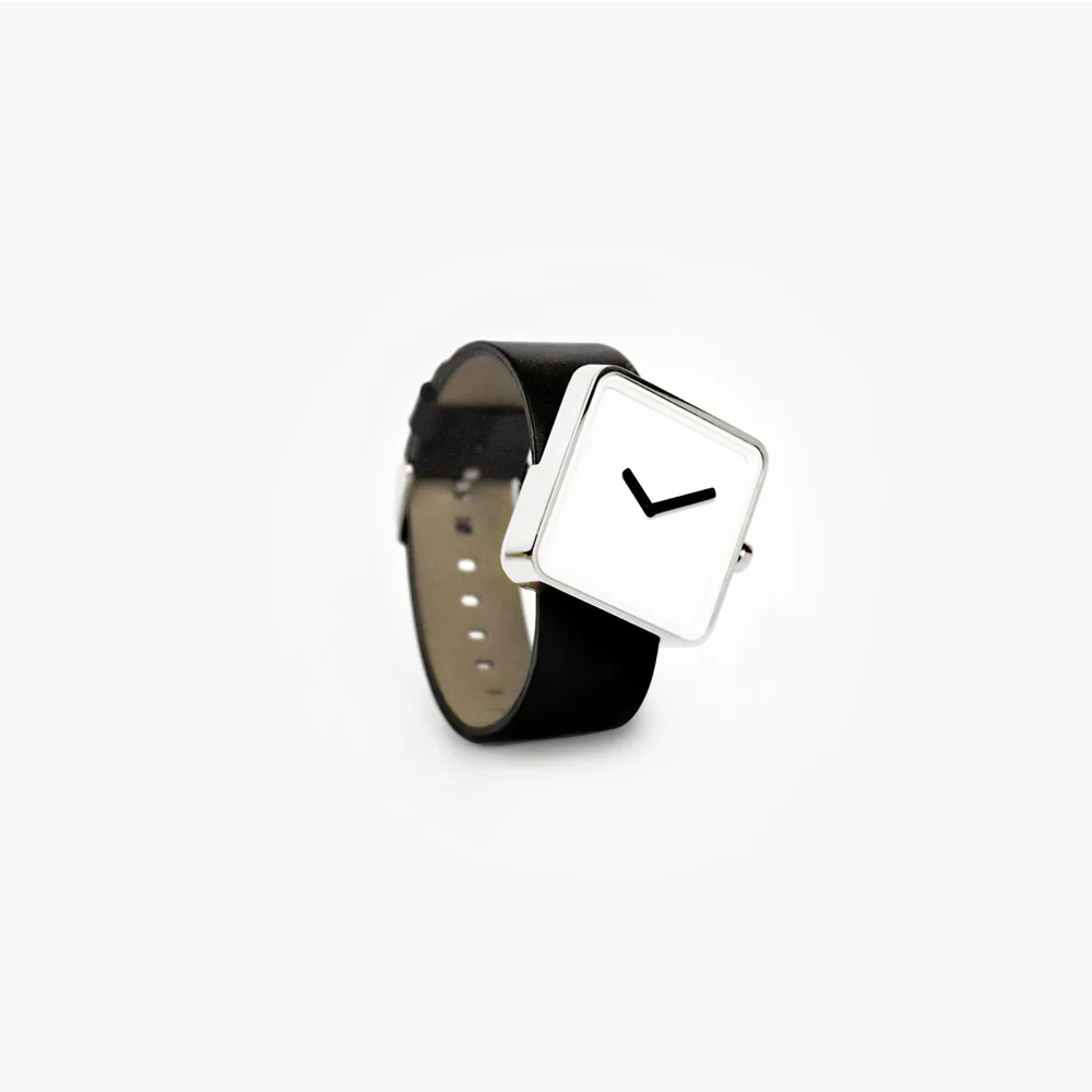 Slip Watch Client: Nonlinear 2011 The Slip Watch is the first product released by nonlinear studio. The design takes the simple archetypal watch shape and puts it into motion with a slight twist. The skewed posture of the watch gives the modern clean lines a new “spin”. The watch is intentionally minimal, with proportions that are almost predictable. However, its skewed posture that makes the watch appear to be slipping off the band, like a moment caught in time; a poetic commentary the passing of time. At the same time, a more ergonomic result is achieved with the face addressing the wearer with less turning of the arm. Furthermore, the band penetrates the casing at 12 and 9 hours marking, giving reference to an otherwise unmarked face. This slightest tweak has given a timeless form an intriguing character while giving you a watch that is easier to read. The Slip Watch sold at the MoMA store and retailers world wide. 
