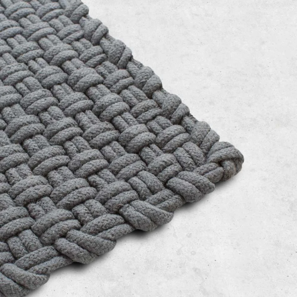 Basket Weave Rug Client: Hem 2014 As its name suggests, the Basketweave rug is an intricately woven mixture of wool and cotton. Available in five different colors, it creates a rustic feel when paired with bare floorboards.