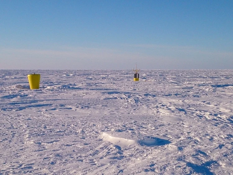 Ice tethered profiler (foreground) and Autonomous Ocean Flux Buoy (background).