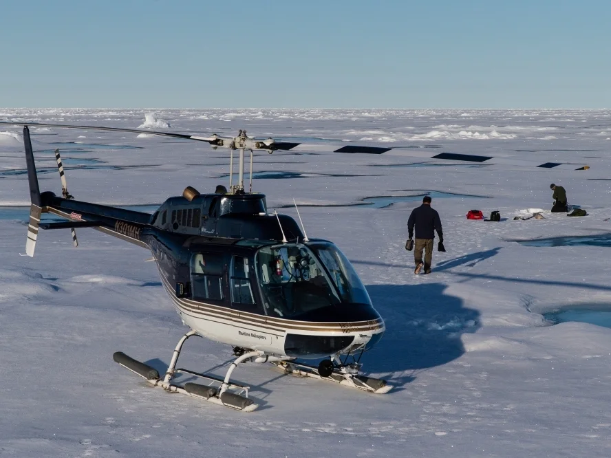 Deploying Ice Mass Balance Buoys at the northern end of the array using a Bell Jet Ranger from teh IBRV Araon.
