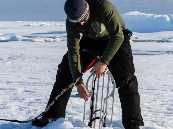 Deploying an acoustic navigation beacon through the ice.
