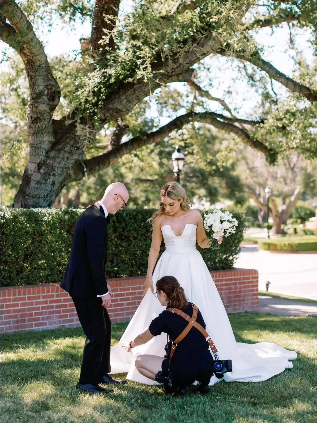 Hi 👋

 I don't post much of myself on here, but here's me on the job -  laying out the gown for those beautiful &quot;mantle portraits&quot;, or sometimes I'm pinning the boutonnieres on the groomsmen, or carrying your bouquet between photo spots. J