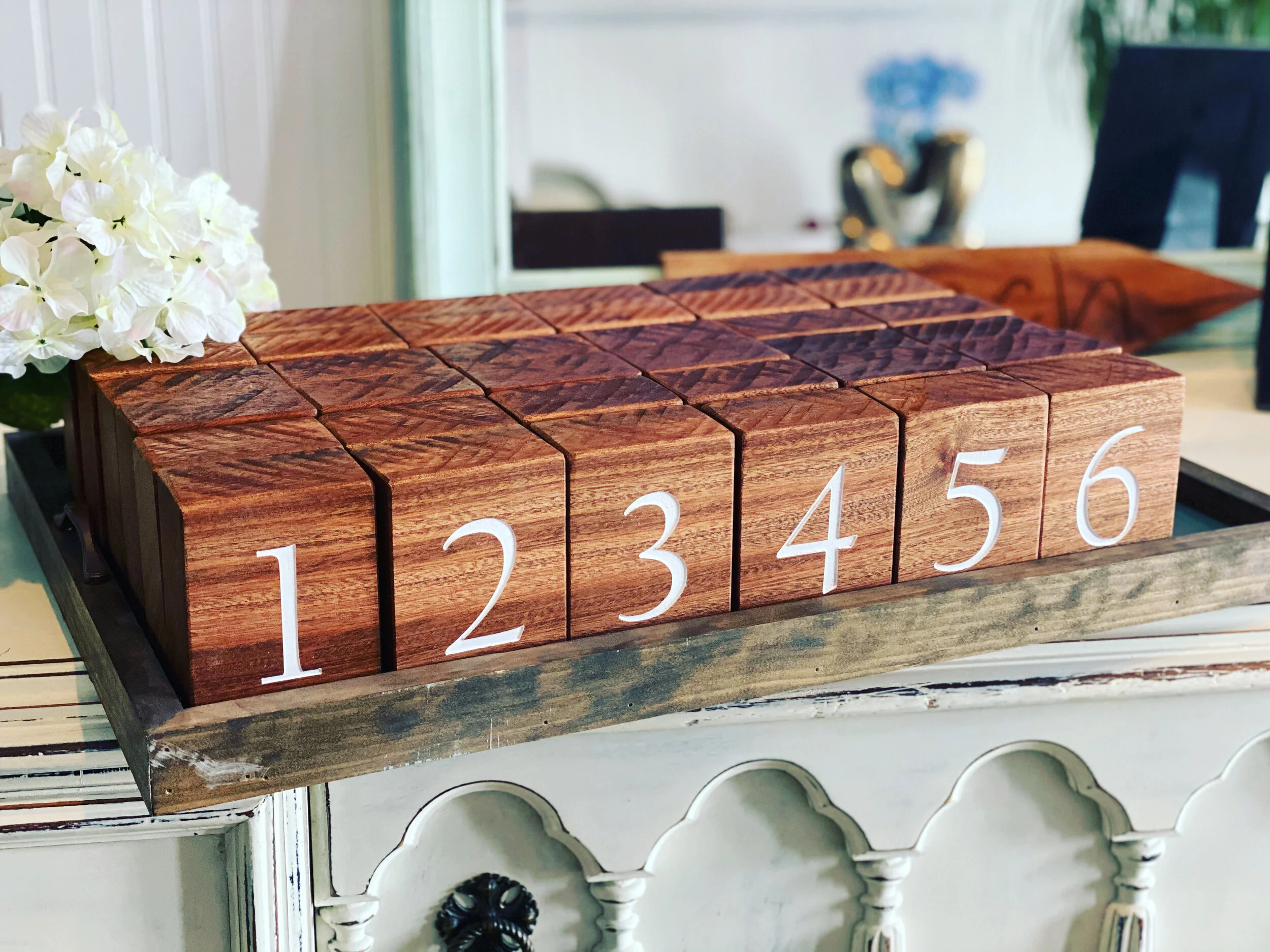 Rustic block table letters! Perfect for any rustic themed event, available to purchase or rent. Carved from a slab of solid mahogany, these beauties stand up perfectly on their own.