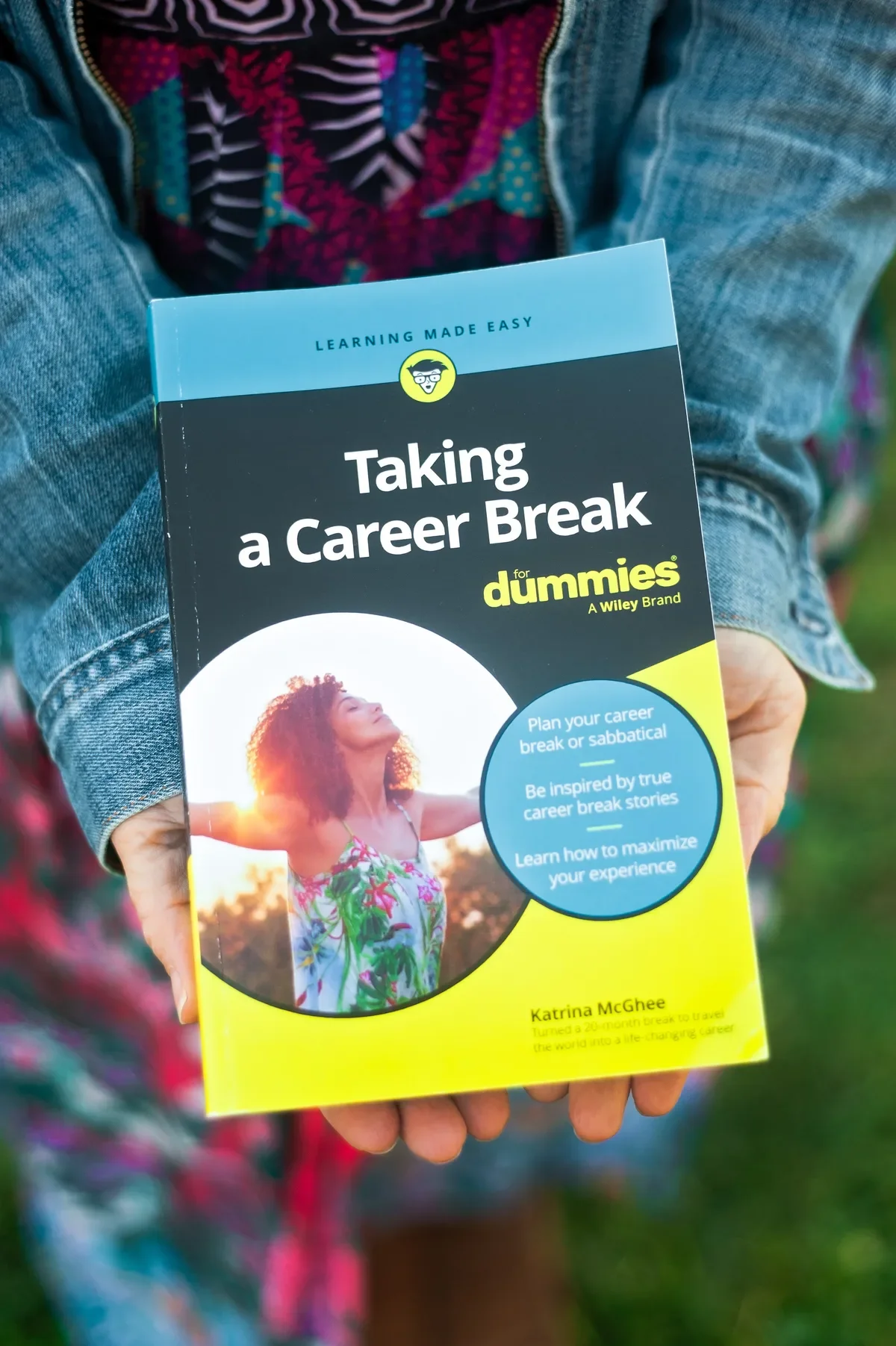 career-break-dummies-book-held-outdoors-1200w.webp