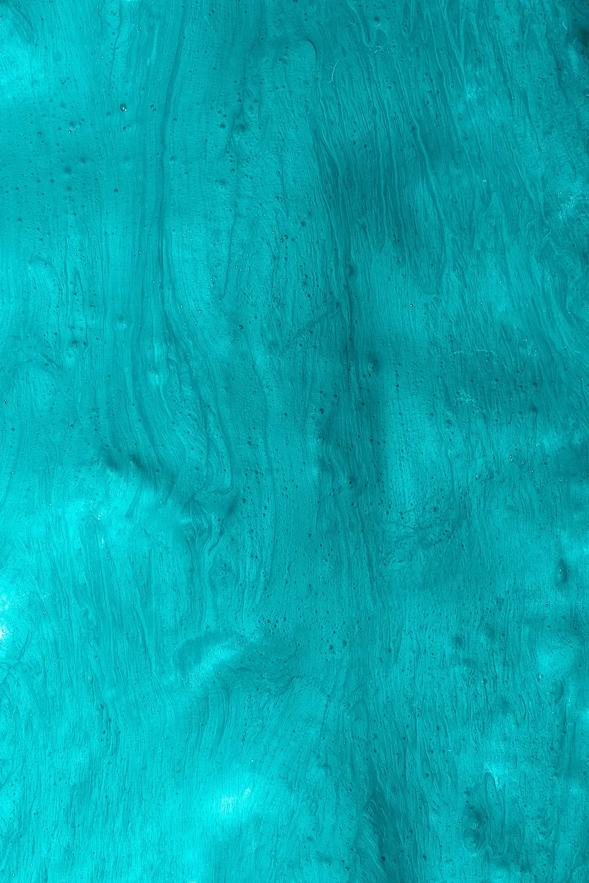 Abstract teal and turquoise paint texture with flowing brushstrokes, an on-brand background accent for career break coaching