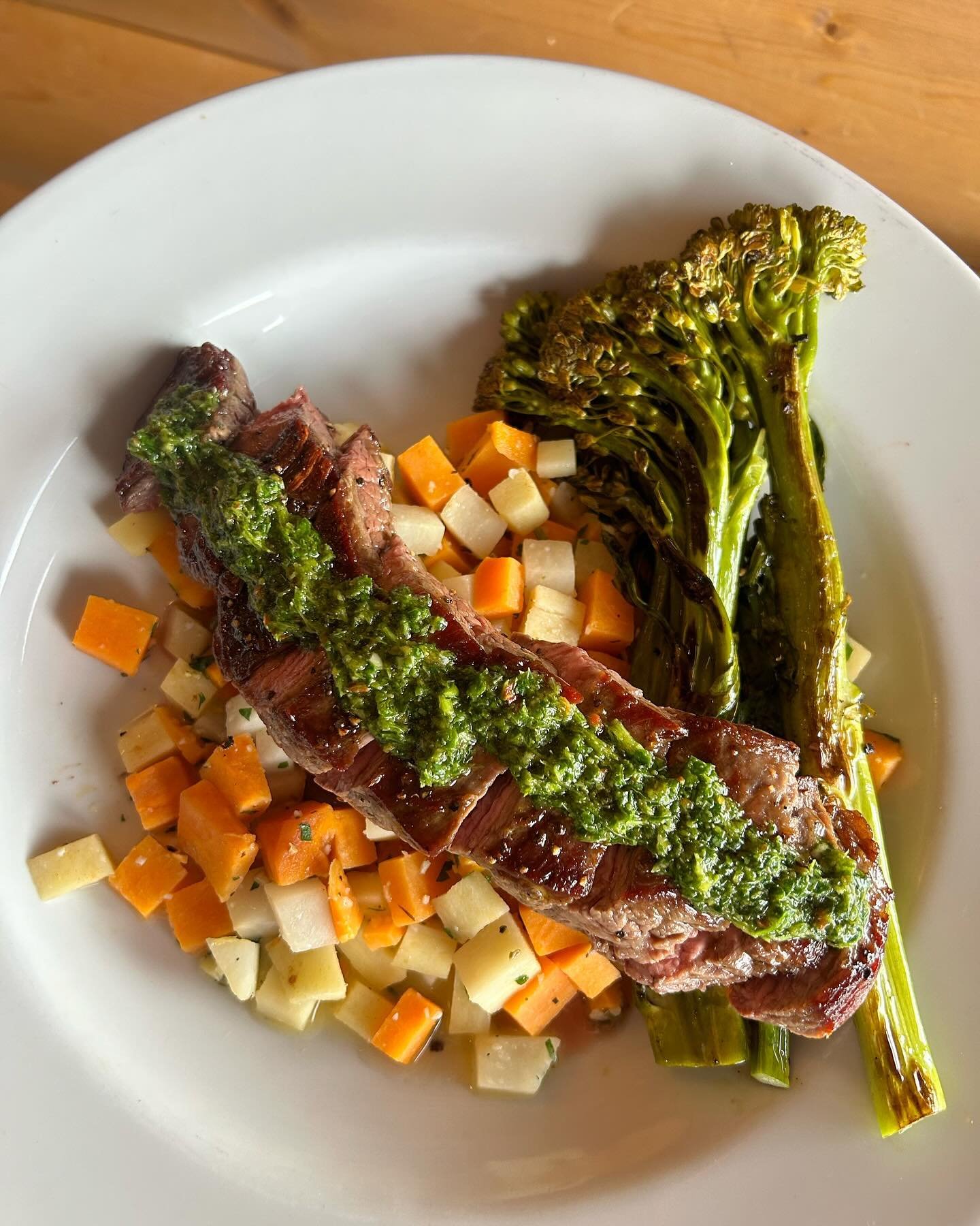 Kipling/Denver Kitchen Special - Chimichurri Steak! Juicy sliced flank steak over garlic-herb butter root veg hash with roasted broccolini &amp; Fresno pepper chimichurri sauce. 
Available nightly after 4pm at our Denver location at 4550 S Kipling Pk