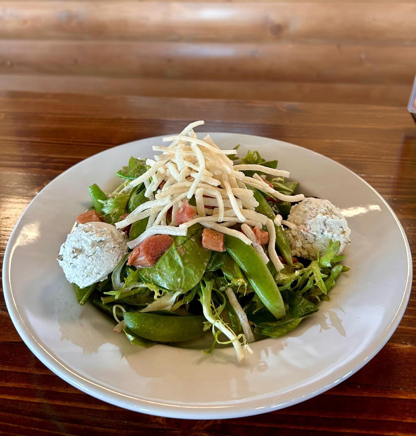 Littleton/Santa Fe - Susitna Seasonal Salad! Spinach &amp; fris&eacute;e tossed in strawberry-white balsamic vinaigrette with roasted rhubarb, charred onion goat cheese, sugar snap peas, &amp; puffed rice noodles! 
Only available at our Littleton loc