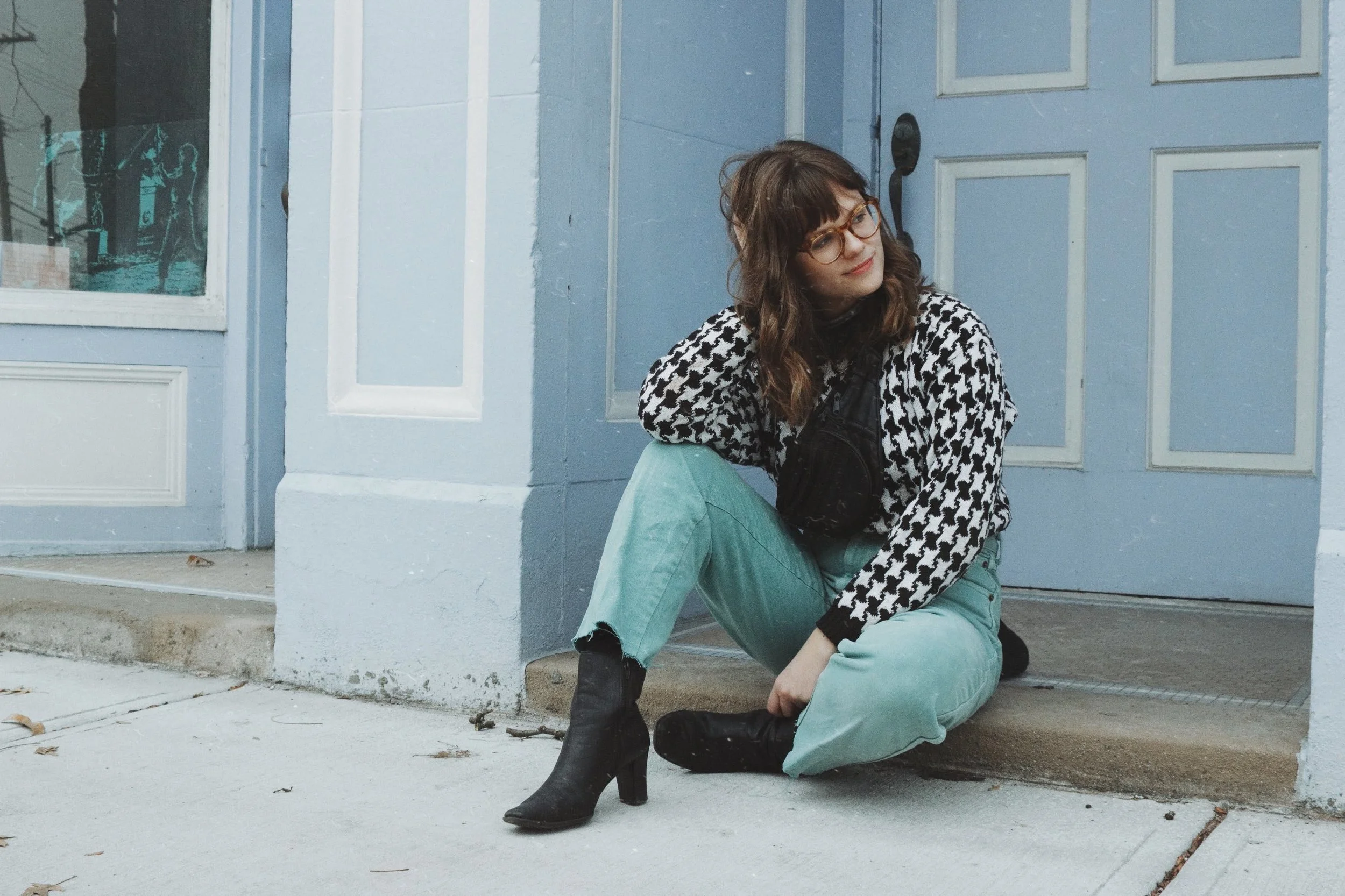 Thrifted items: Block heel boots Seafoam green mom jeans Black and white sweater Photo by Nicole Bogdanovic