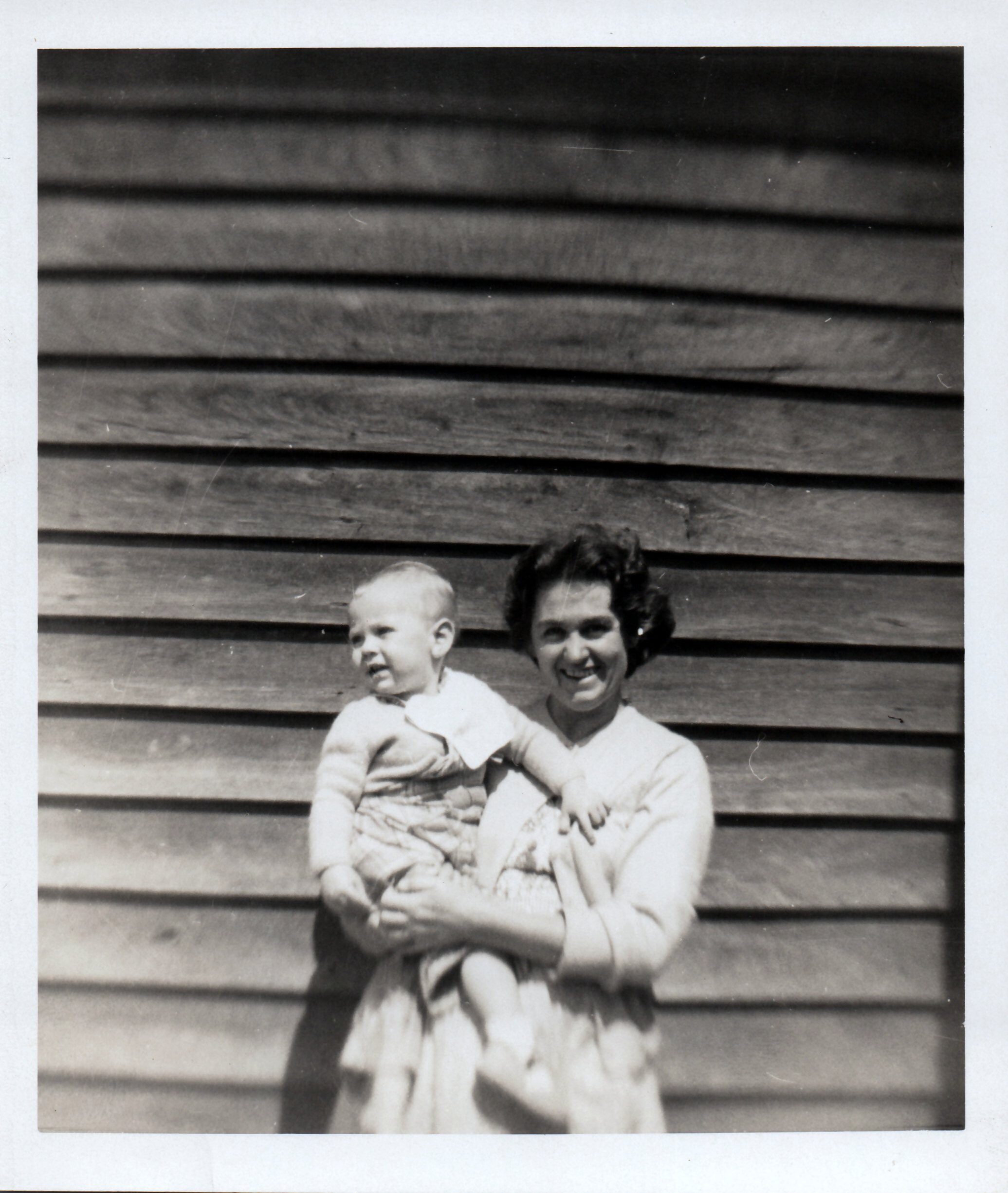 Our mother, Noeline, the youngest of five children, abandoned by her mother, holding my first little brother Steven.