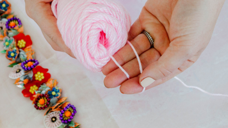 Pull Yarn from the Skein for a Pom Pom
