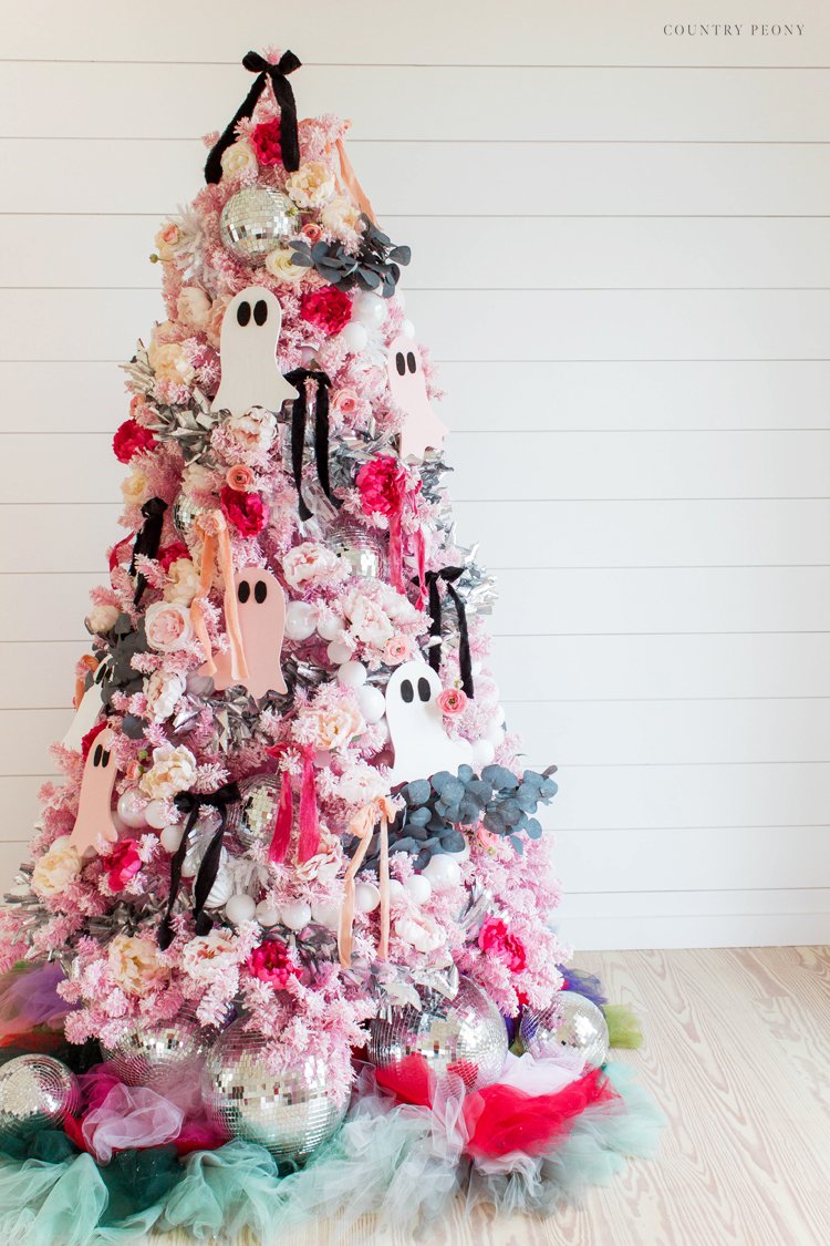 decorating pink christmas tree for halloween