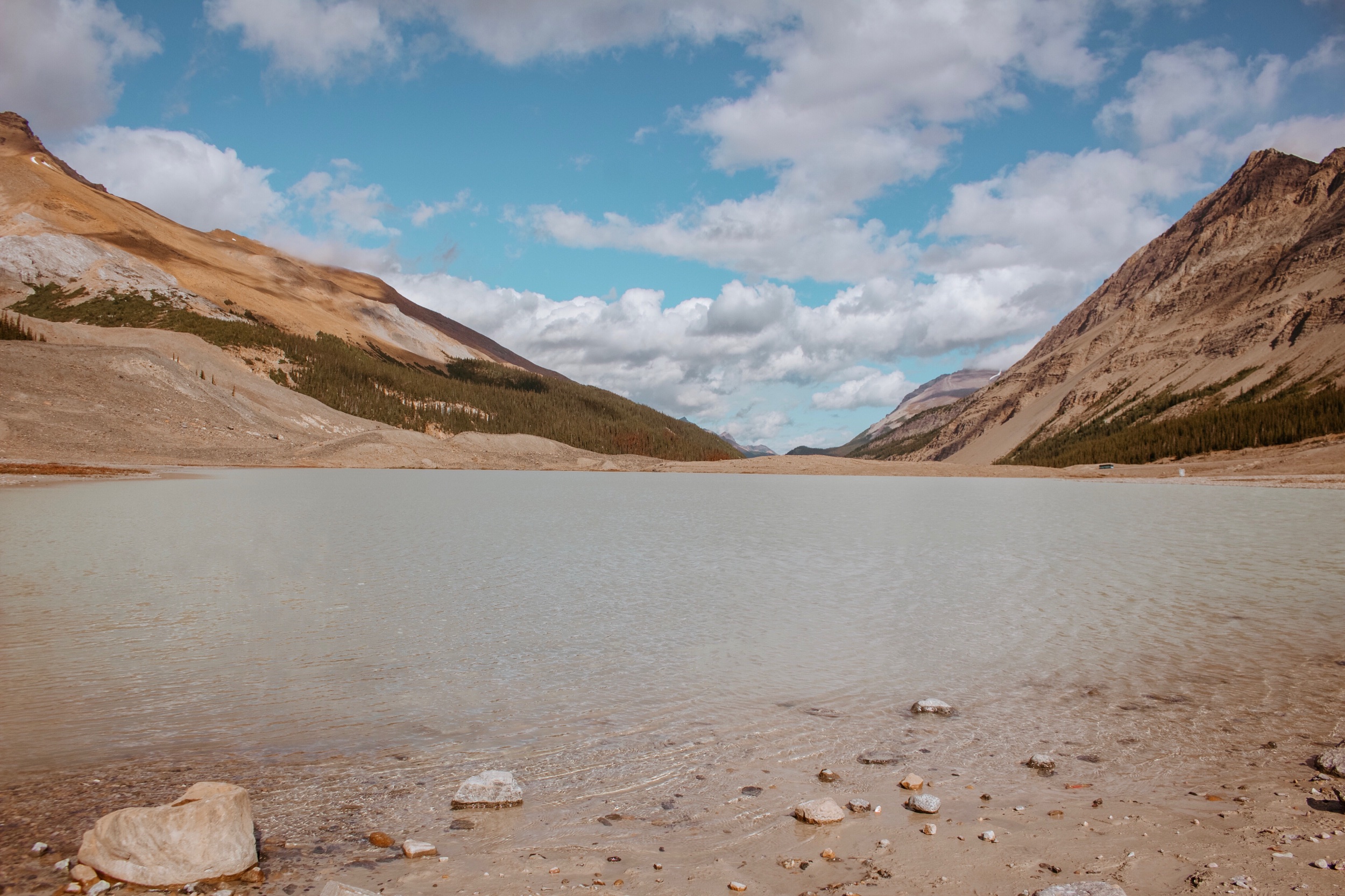 The view from the parking lot at the Athabasca Glacier of a Lake