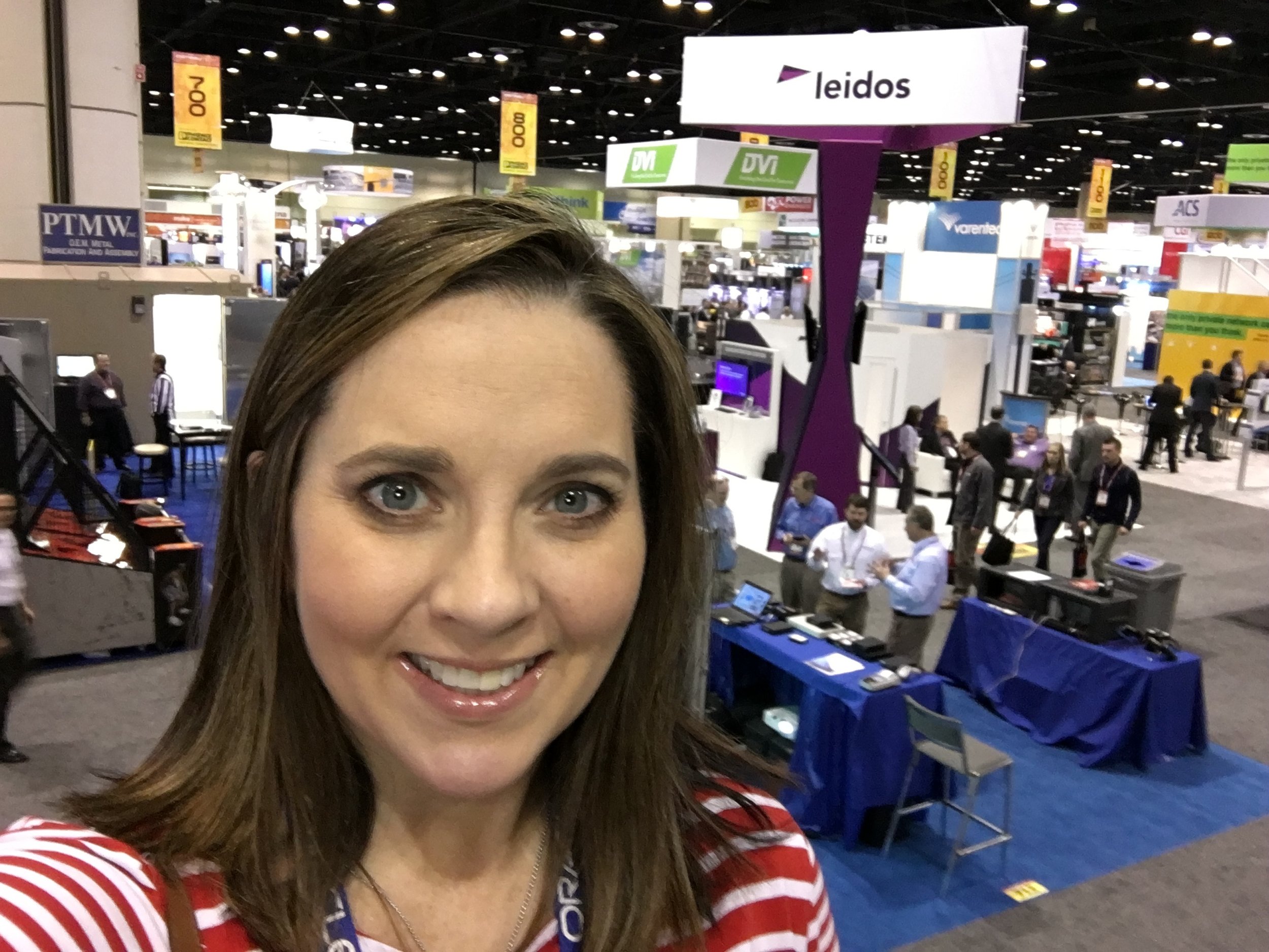 Tradeshow floor is packed and buzzing, quick selfie from the top of a 2 story exhibit booth. 