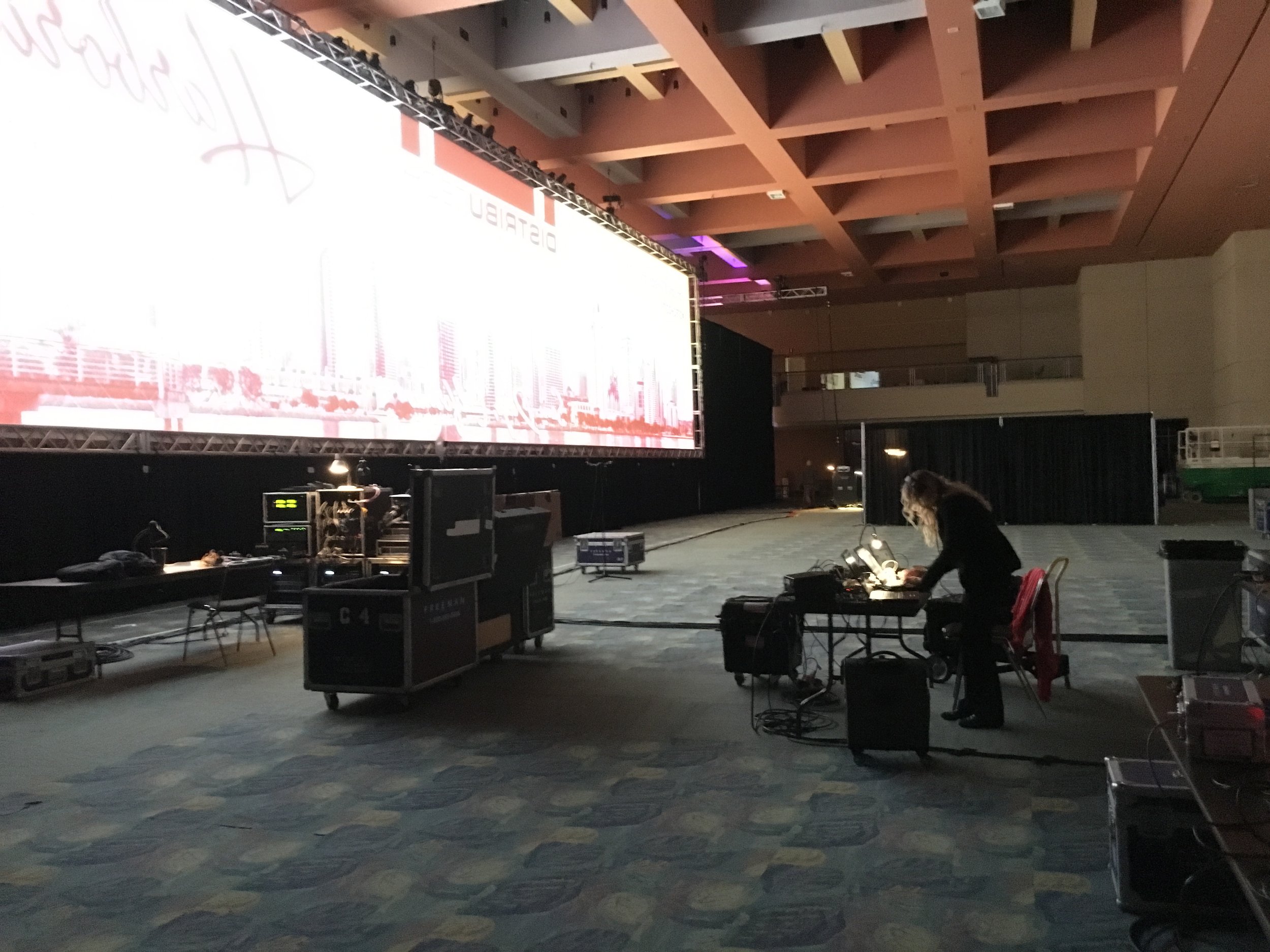 A peek backstage, wow that screen is huge! We share backstage space with Freeman, a highly respected company in the event industry. They are providing all AV/Production services for our clients and are great to work with. 