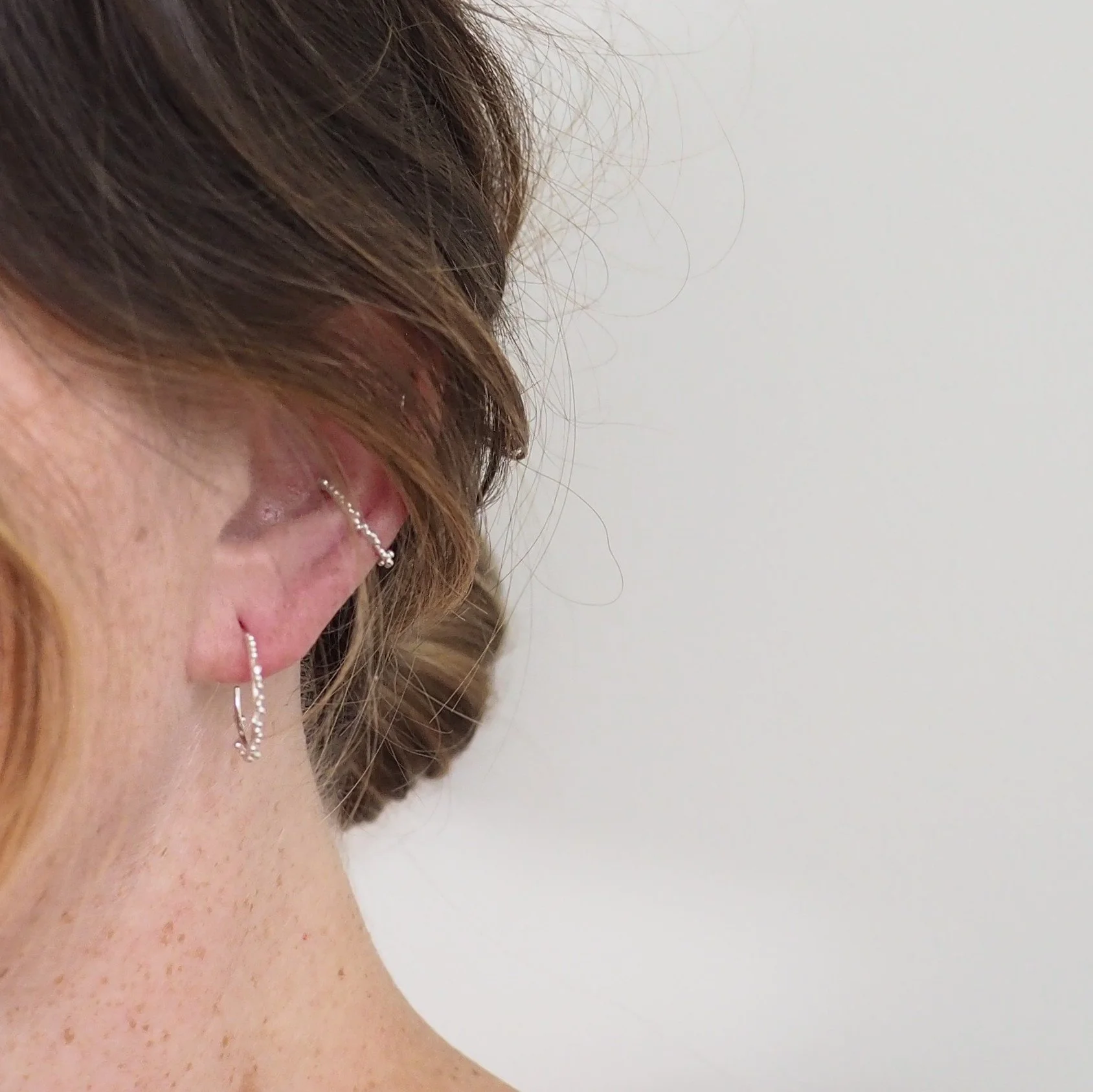 Recycled Silver Hoop Earring, Small size with granulated details being worn