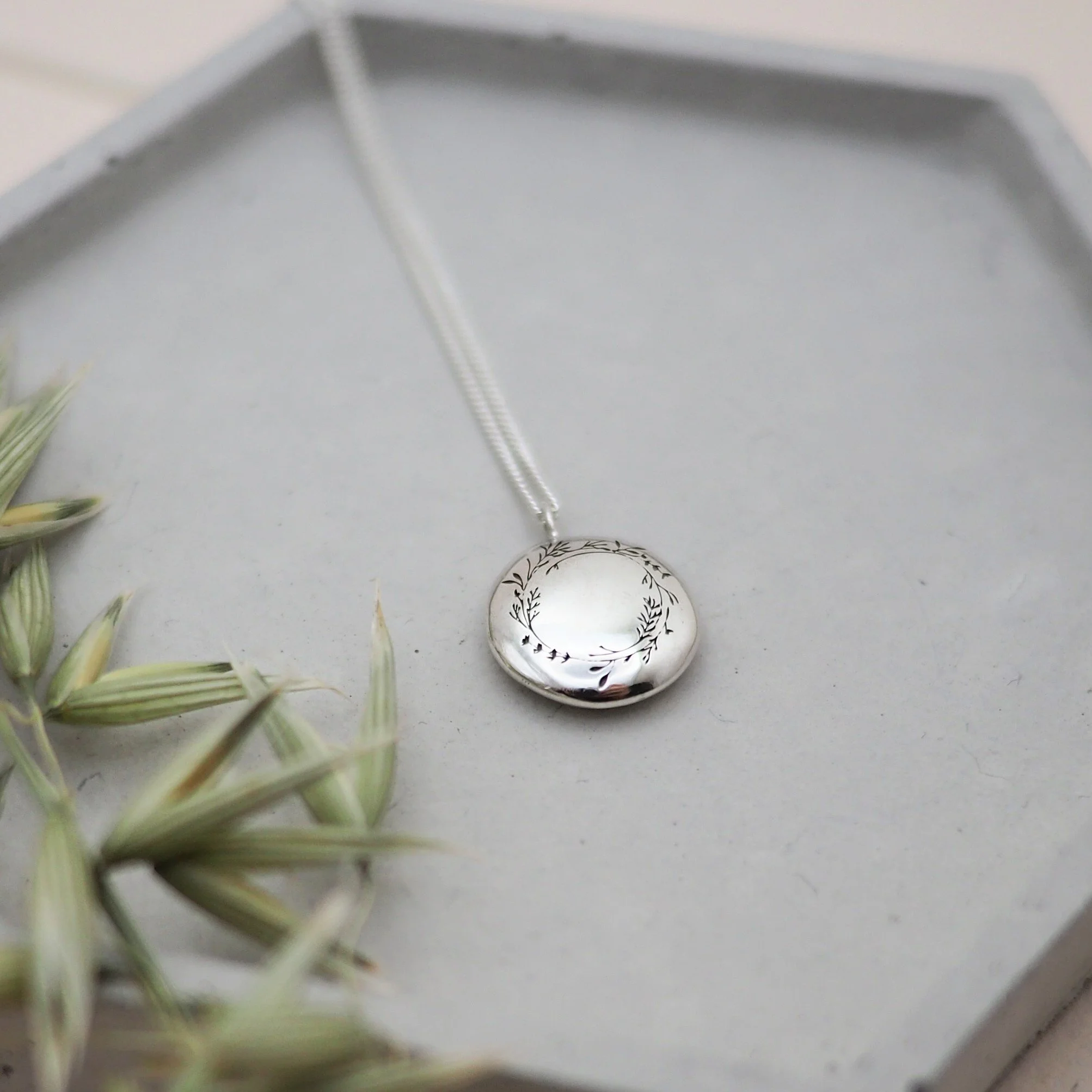 Floral wreath pendant in recycled silver