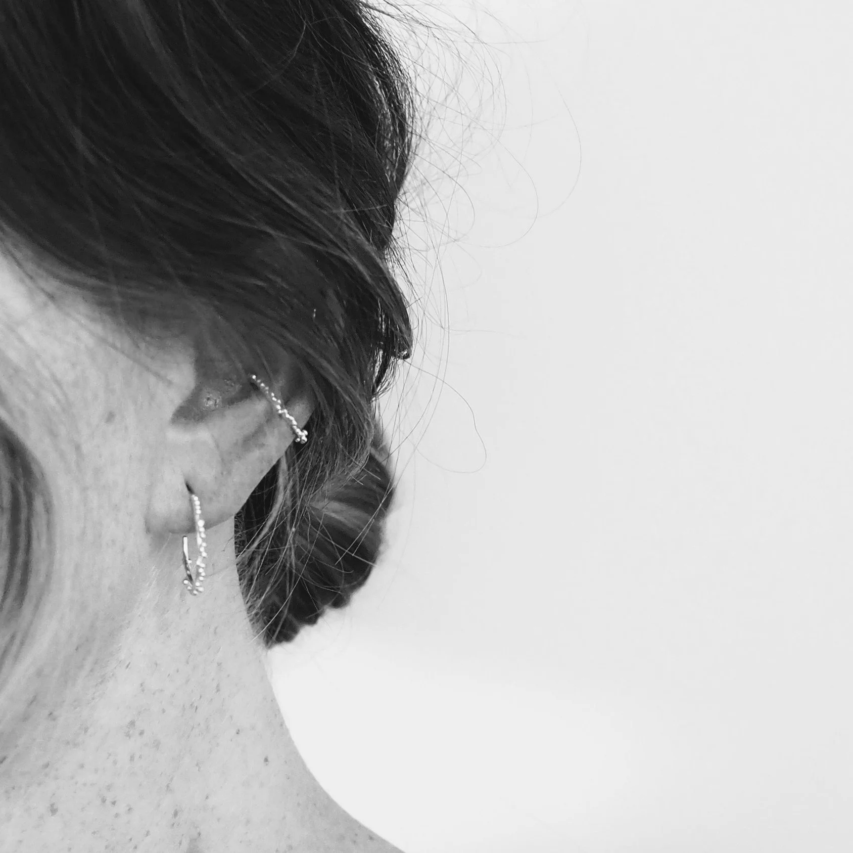 Recycled Gold Sol Hoop Earrings being worn