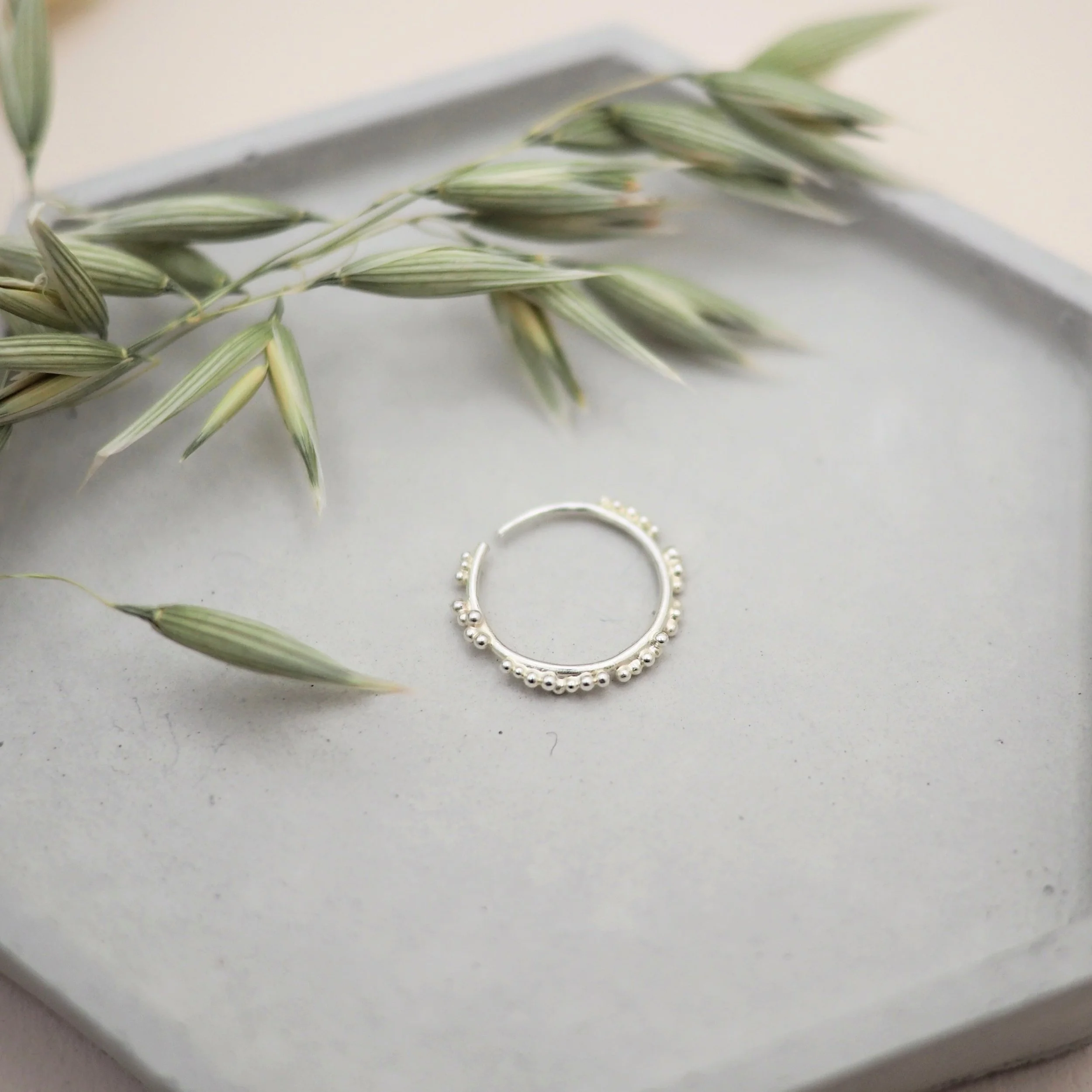 Sol sleeper conch piercing in recycled silver