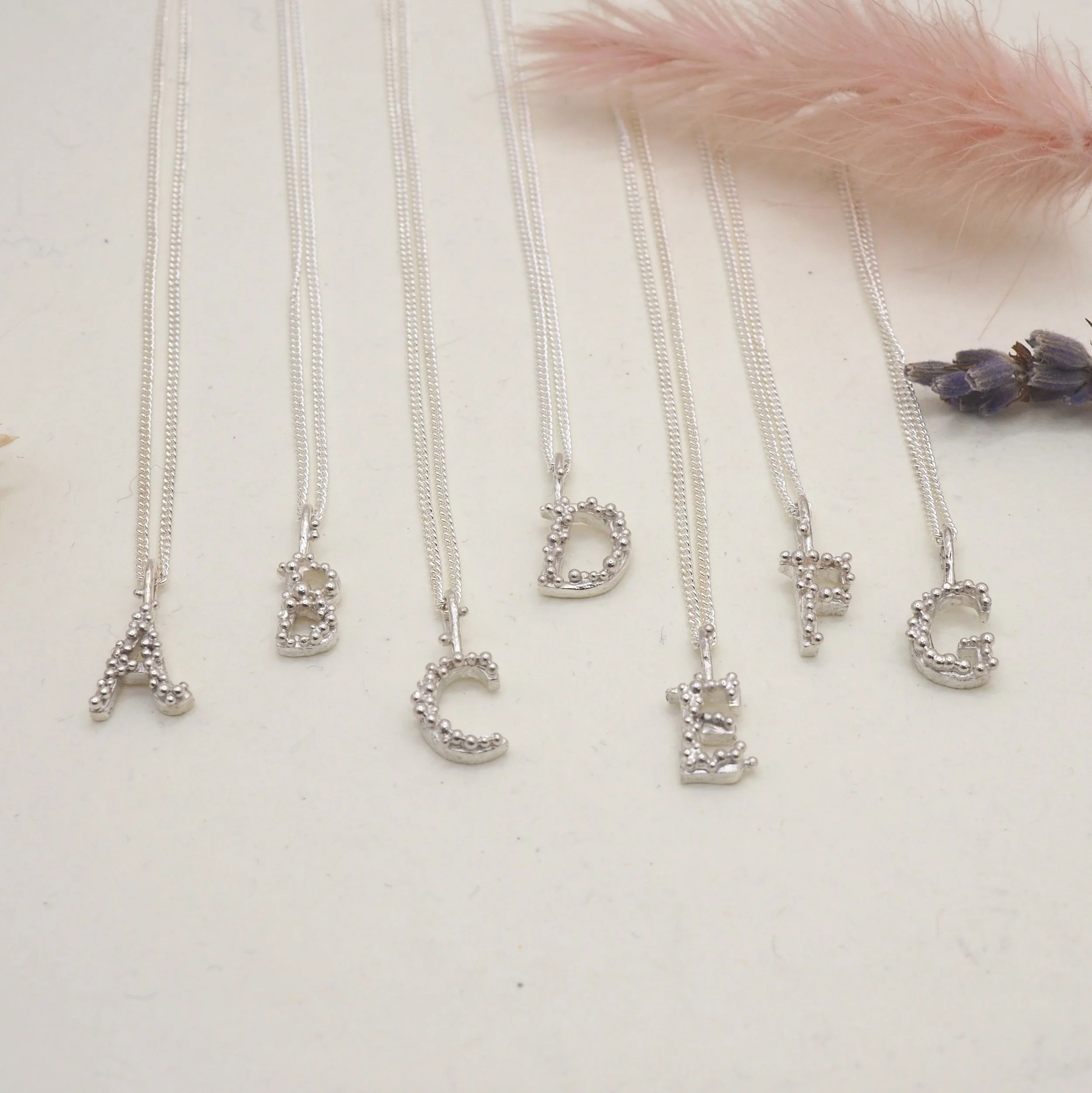 Kate-Wainwright-Jewellery-Recycled-Silver-Gold-Initial-Letter-Alphabet-Pendants.jpeg