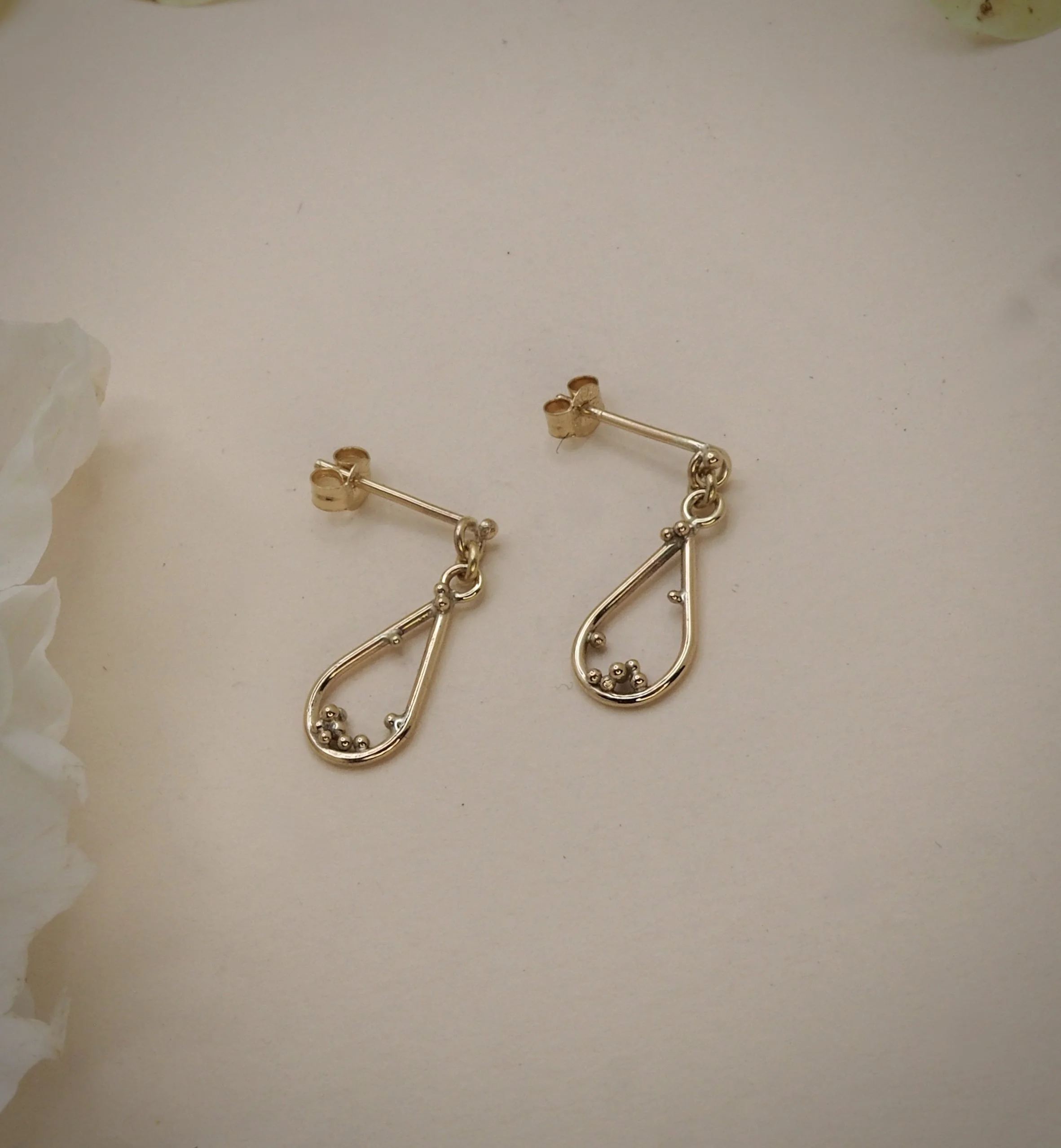 Recycled 9ct yellow gold pear drop earrings with gold granules to decorate.