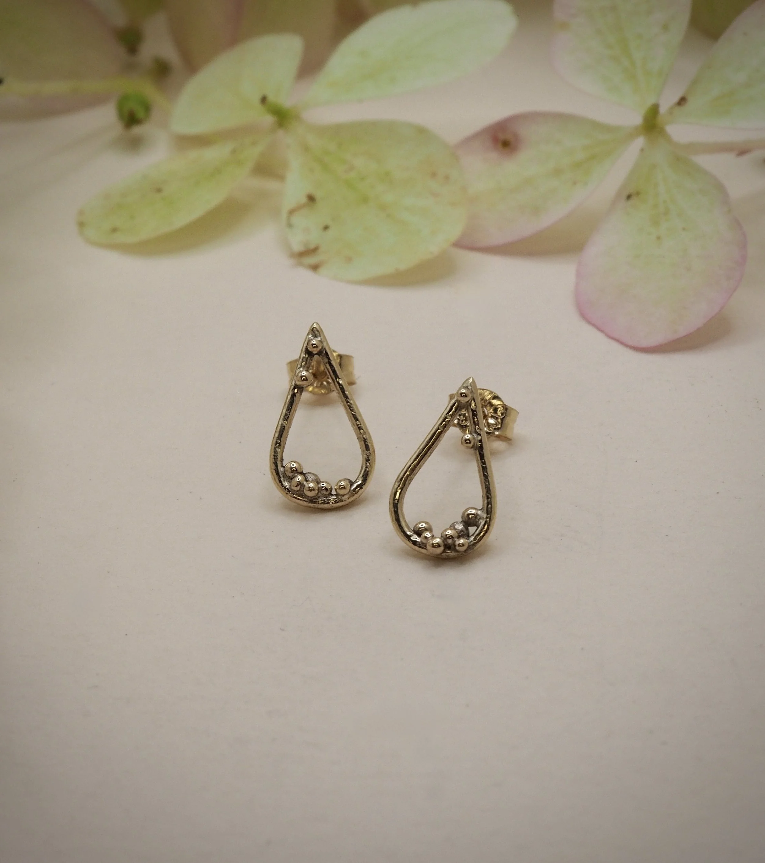 Recycled 9ct yellow gold pear studs with gold granules to decorate.