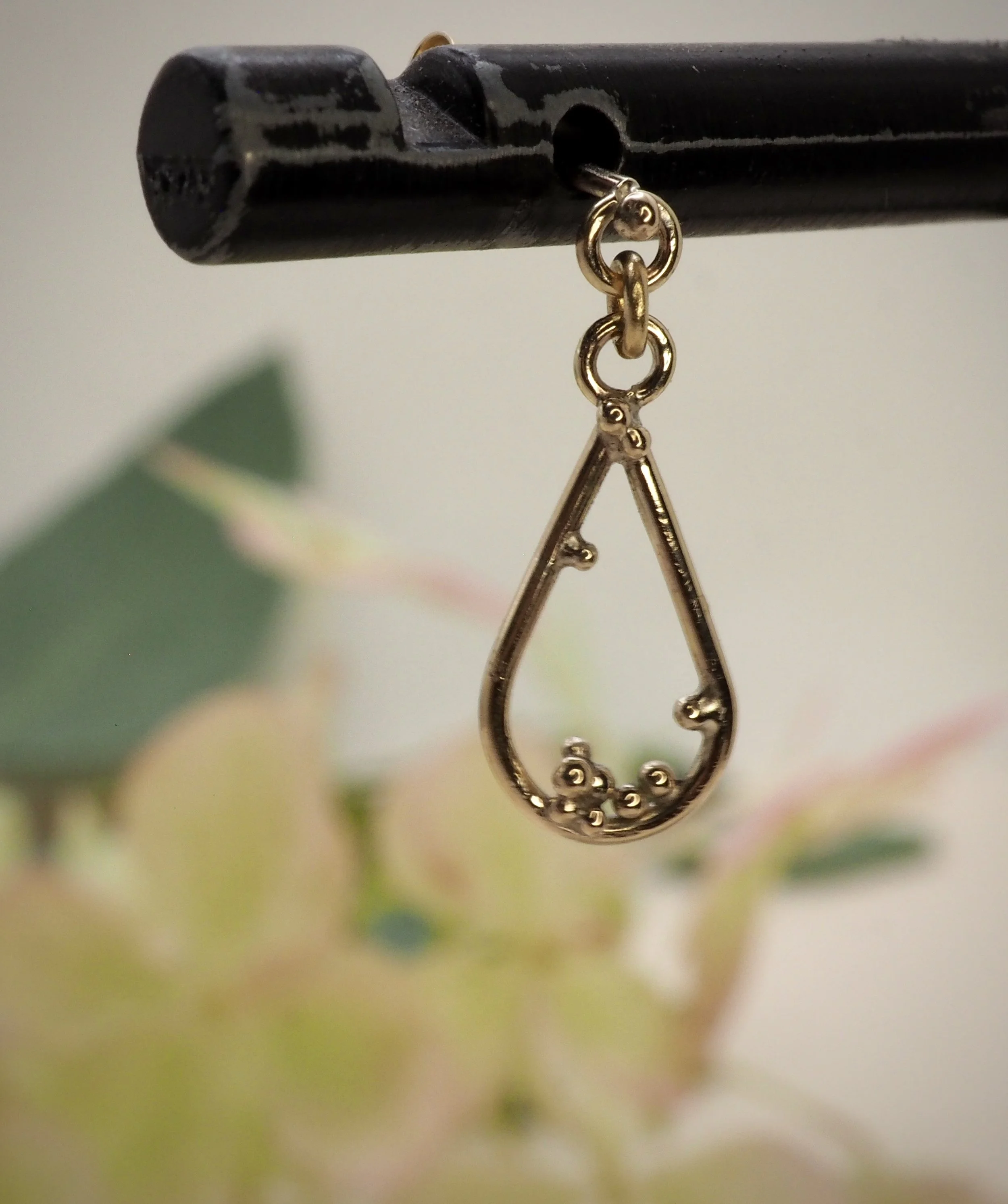 Recycled 9ct yellow gold pear drop earrings with gold granules to decorate.