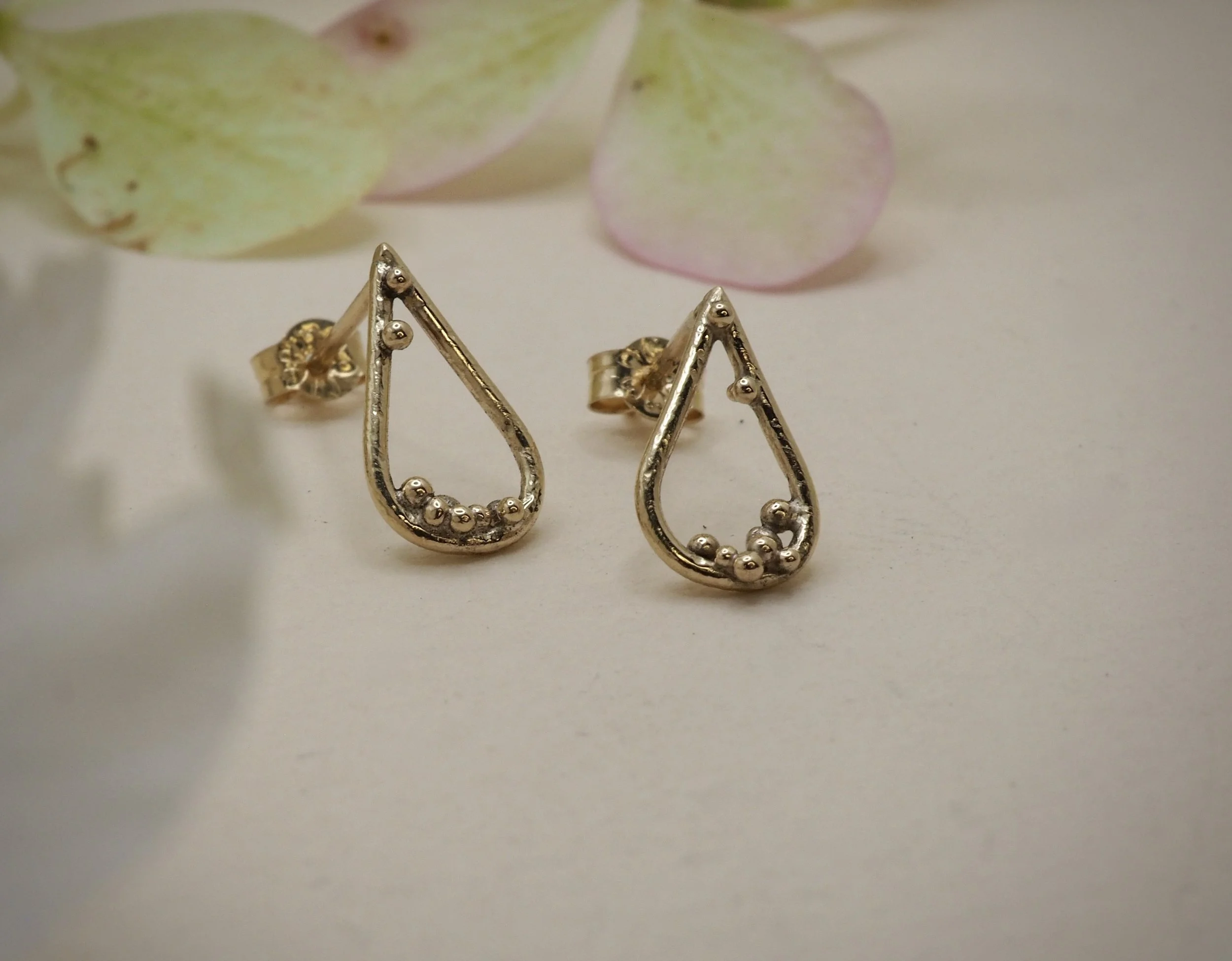 Recycled 9ct yellow gold pear studs with gold granules to decorate.