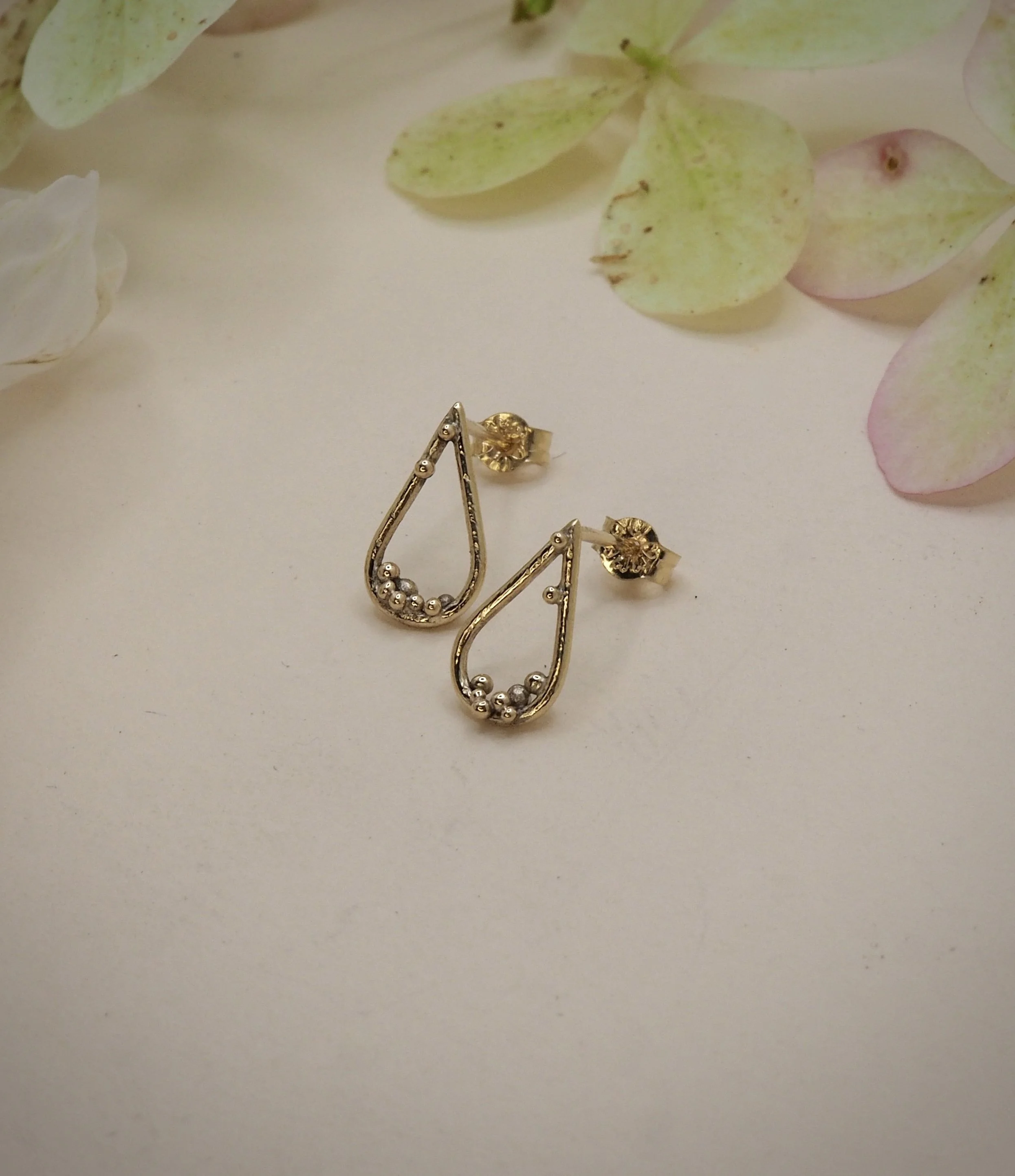 Recycled 9ct yellow gold pear studs with gold granules to decorate.