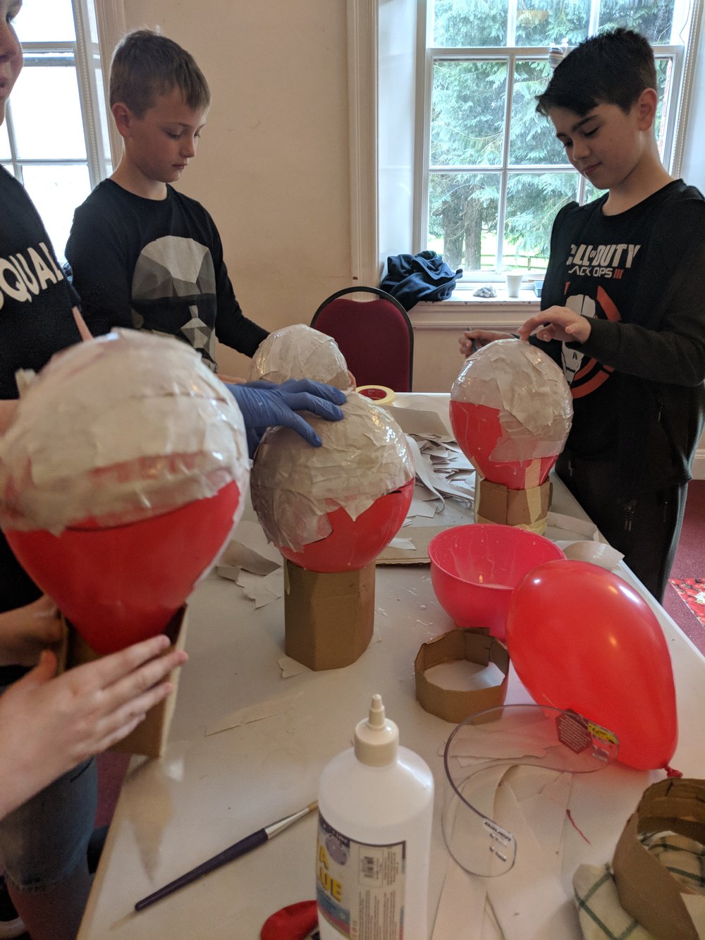 PYSV Juniors making papier mache hockey helmets