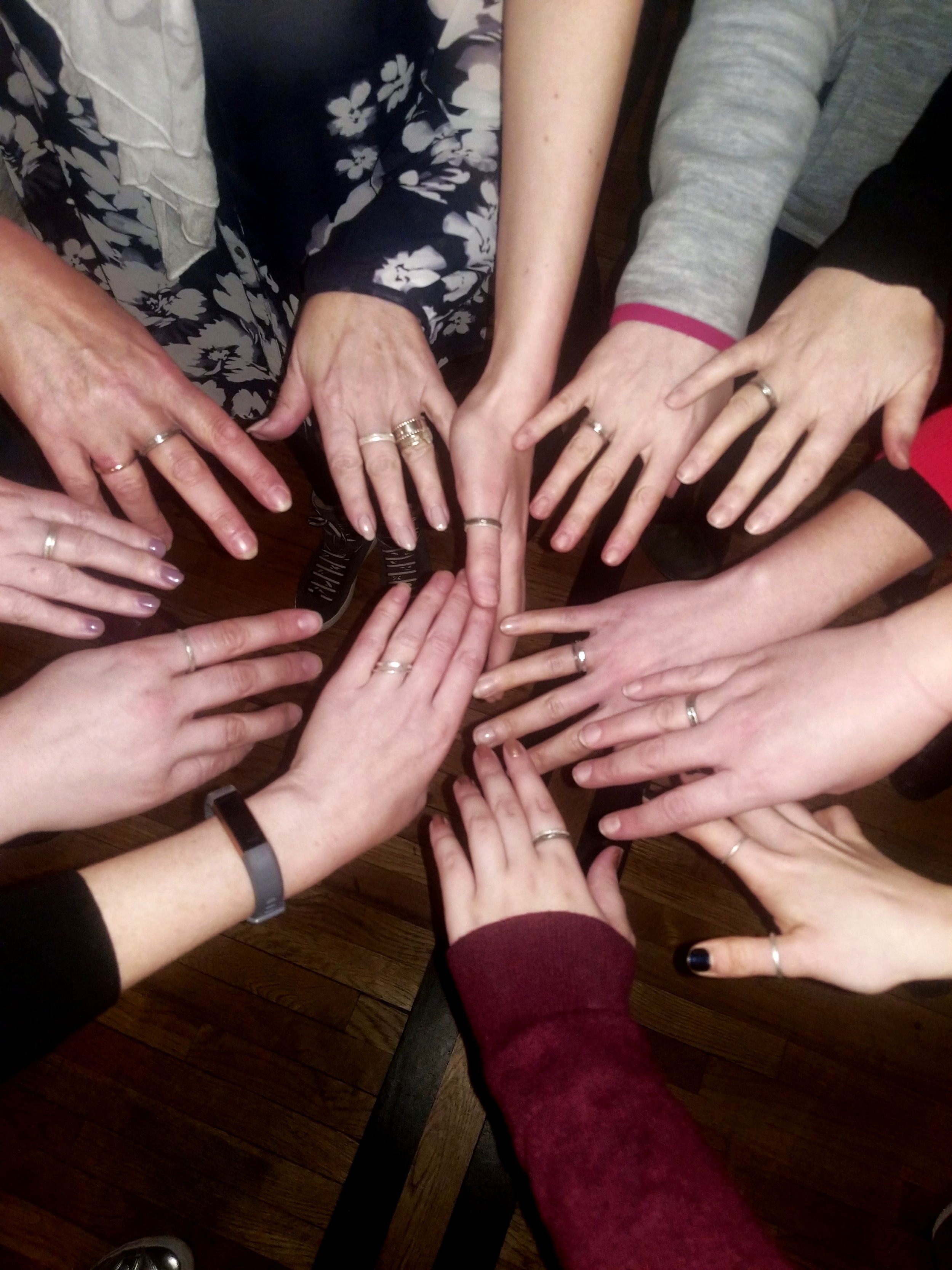 Participants wearing finished handmade silver rings