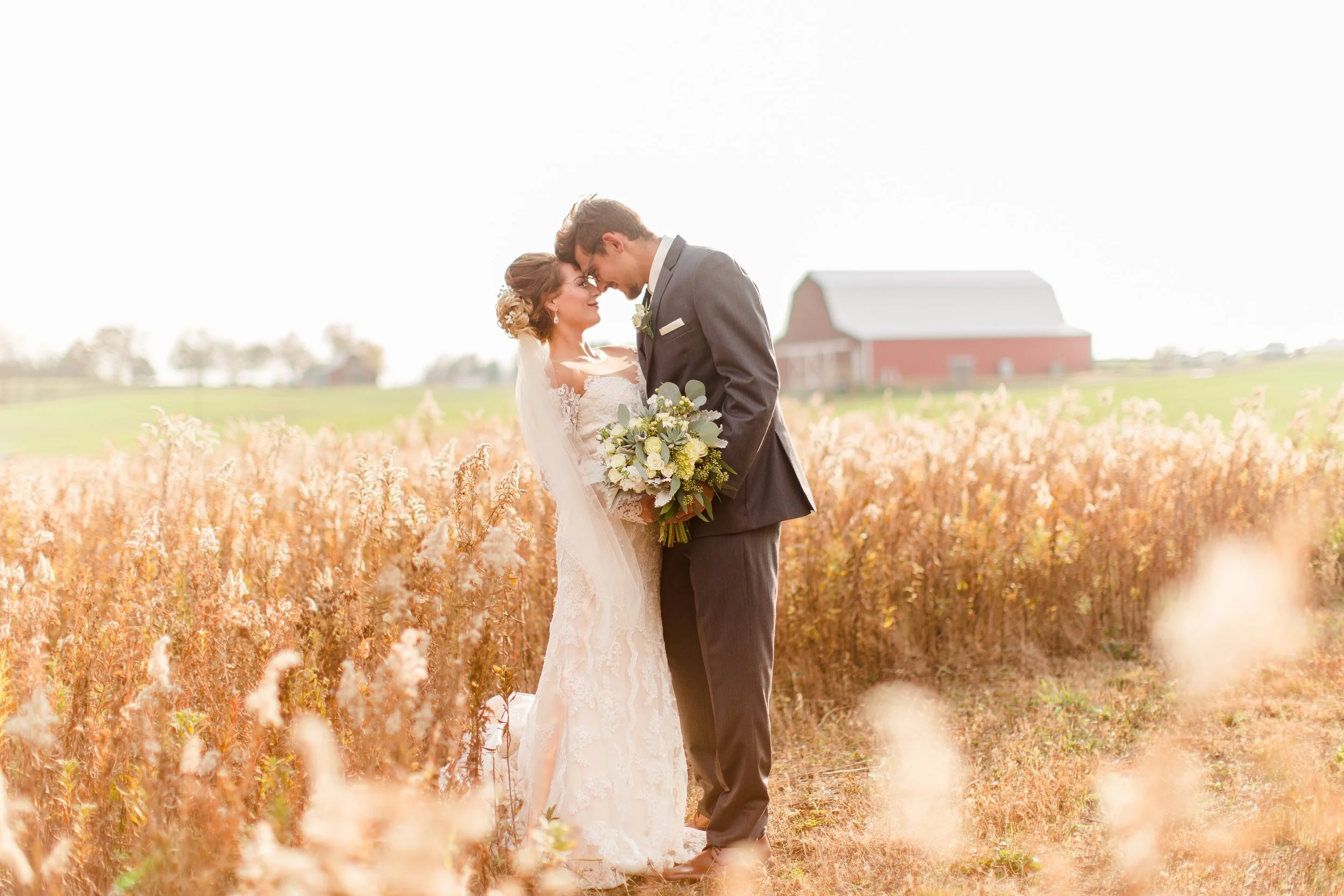 The Barn at Lone Eagle Landing glowing at sunset during a St. Louis area wedding.
