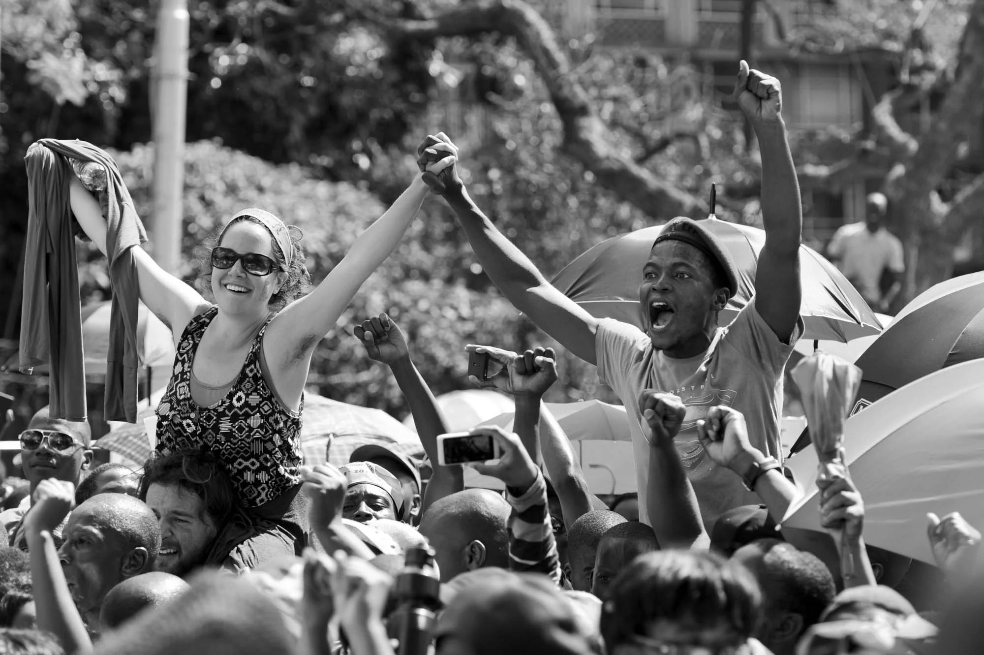  Members of the public singing and cheering outside the Union Buildings in Pretoria 