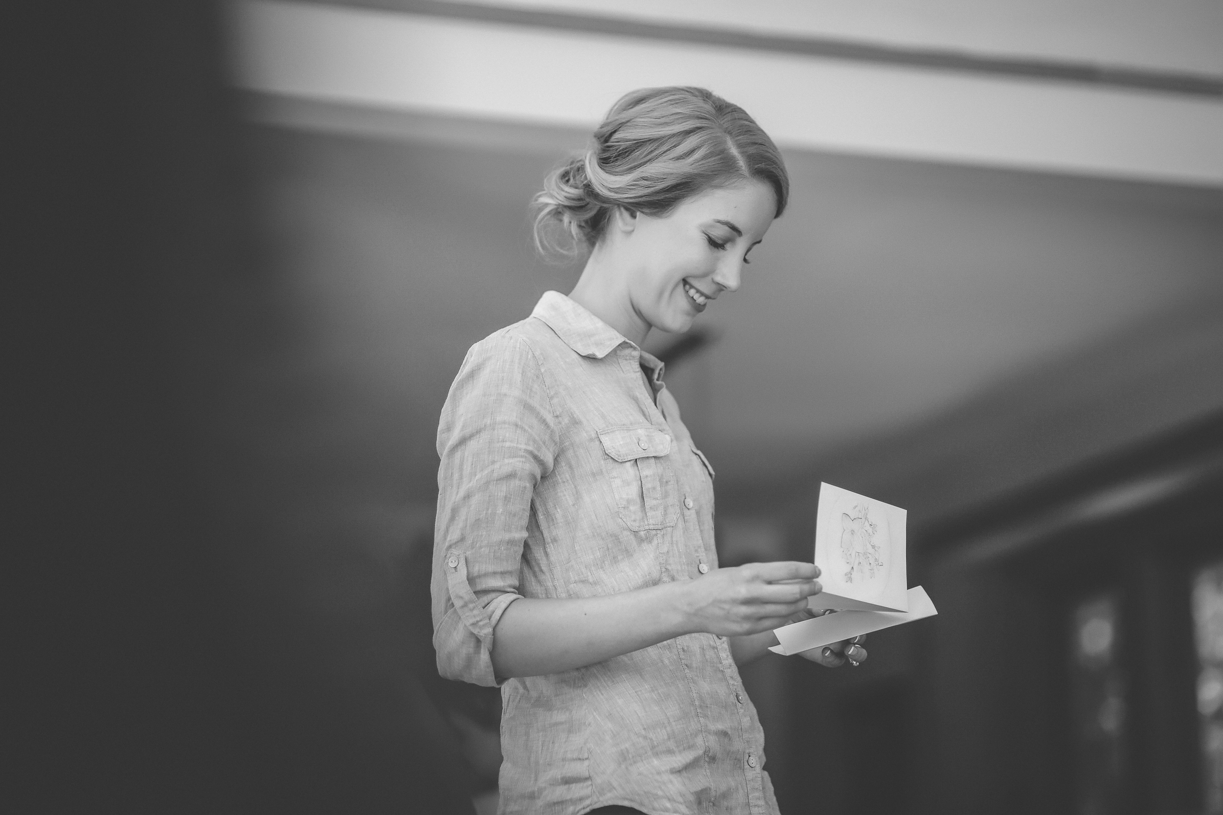 16 Minneapolis home backyard wedding bride getting ready reading letter.jpg