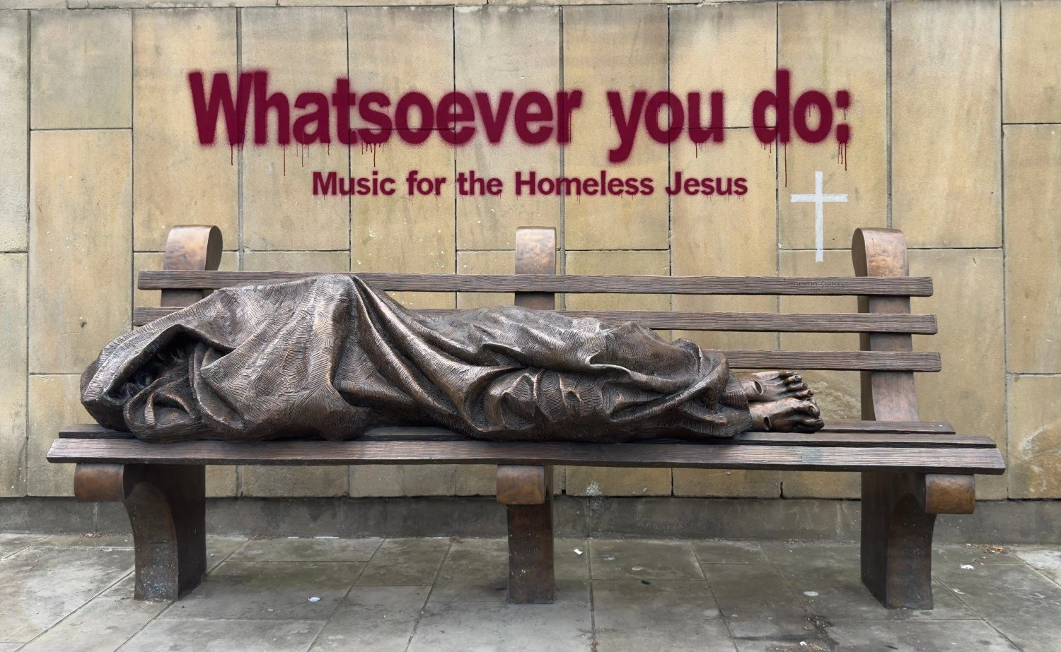 Statue of the Homeless Jesus by Timothy Schmalz outside of at Mary's Cathedral