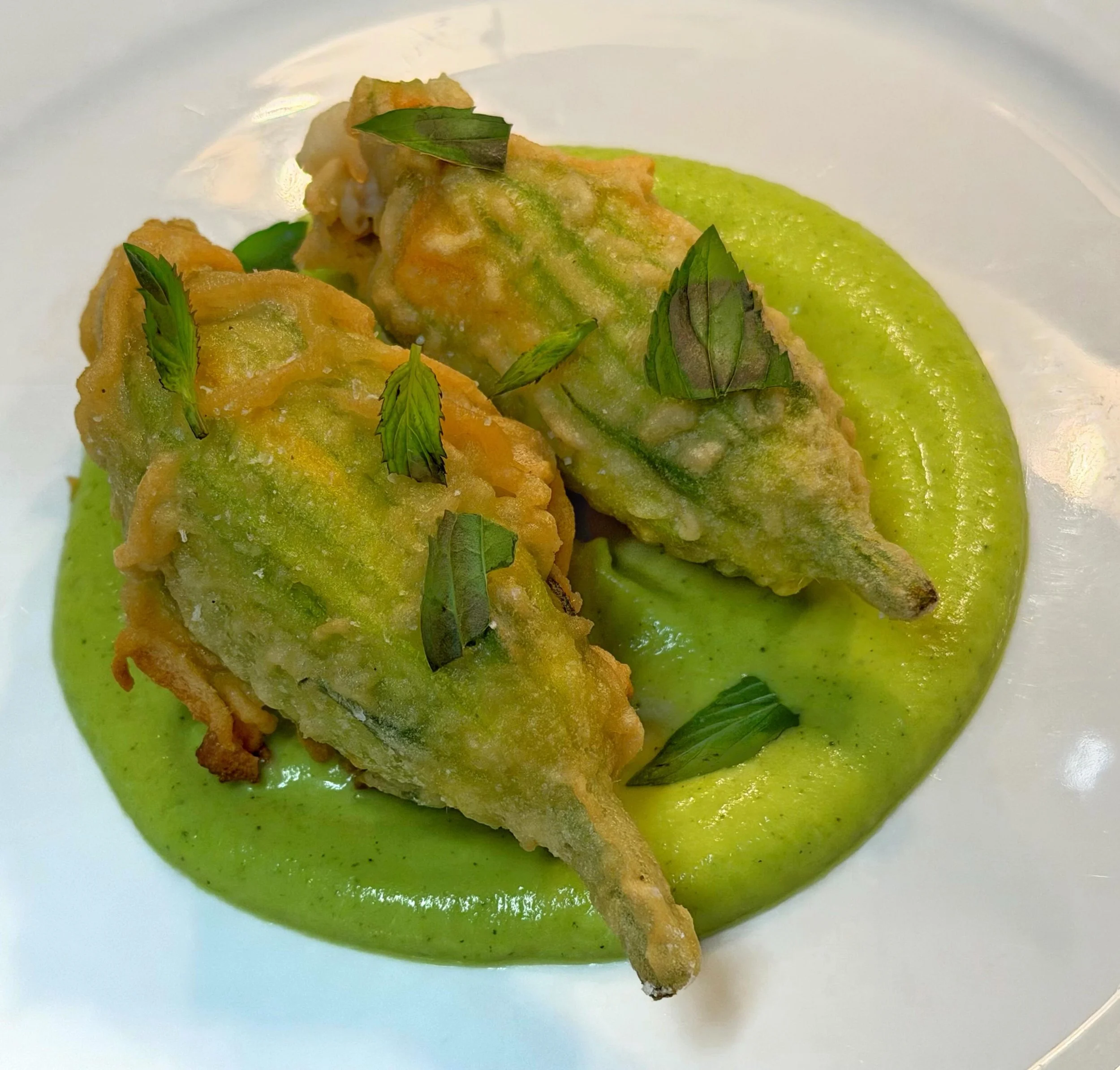 One of our specials from the weekend !!!

Fried Brandade Stuffed Squash Blossoms &bull; Zucchini &ldquo; Crema&bull; Spearmint
#specials #localfood #portlandmaine #summer #crisp