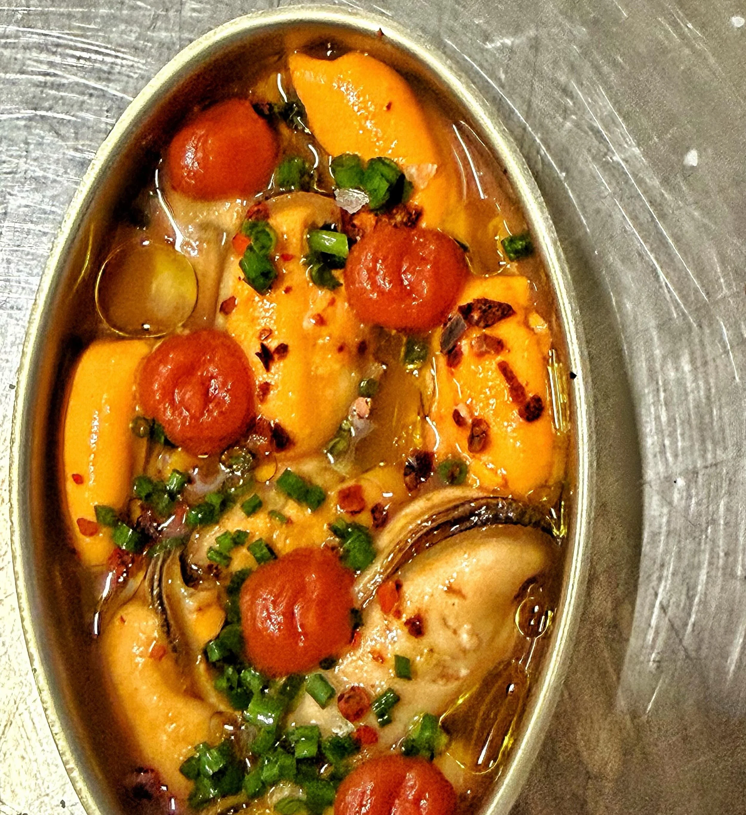 Mussels Escabeche
Bangs Island Mussels &bull; Tomato Coulis &bull; Garlic &amp; Herb Vinegar &bull; Olive Oil &bull; Aleppo &bull; Sourdough