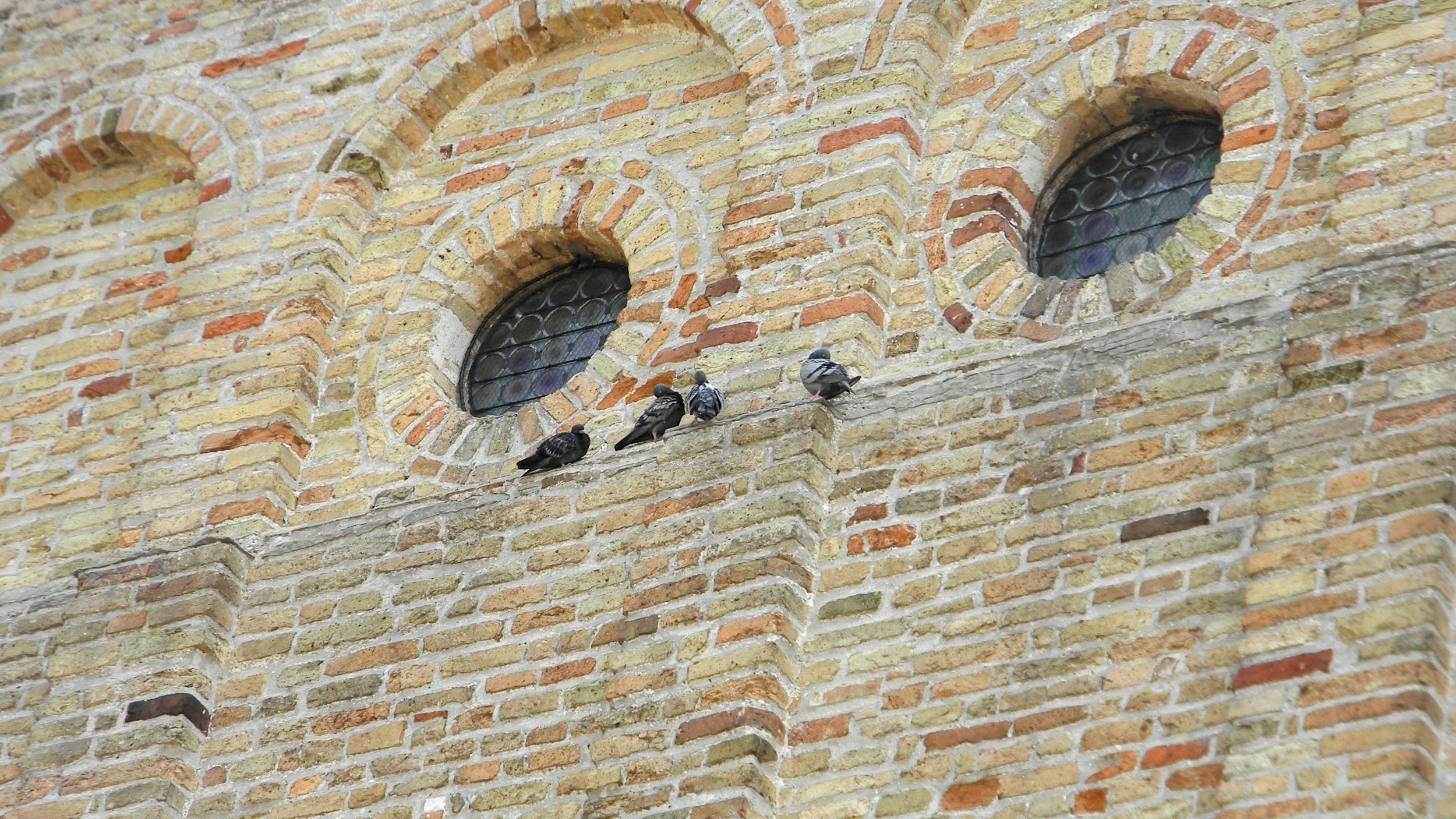 Closeup on the façade of the Basilica di Santa Maria Assunta. Photo by me.
