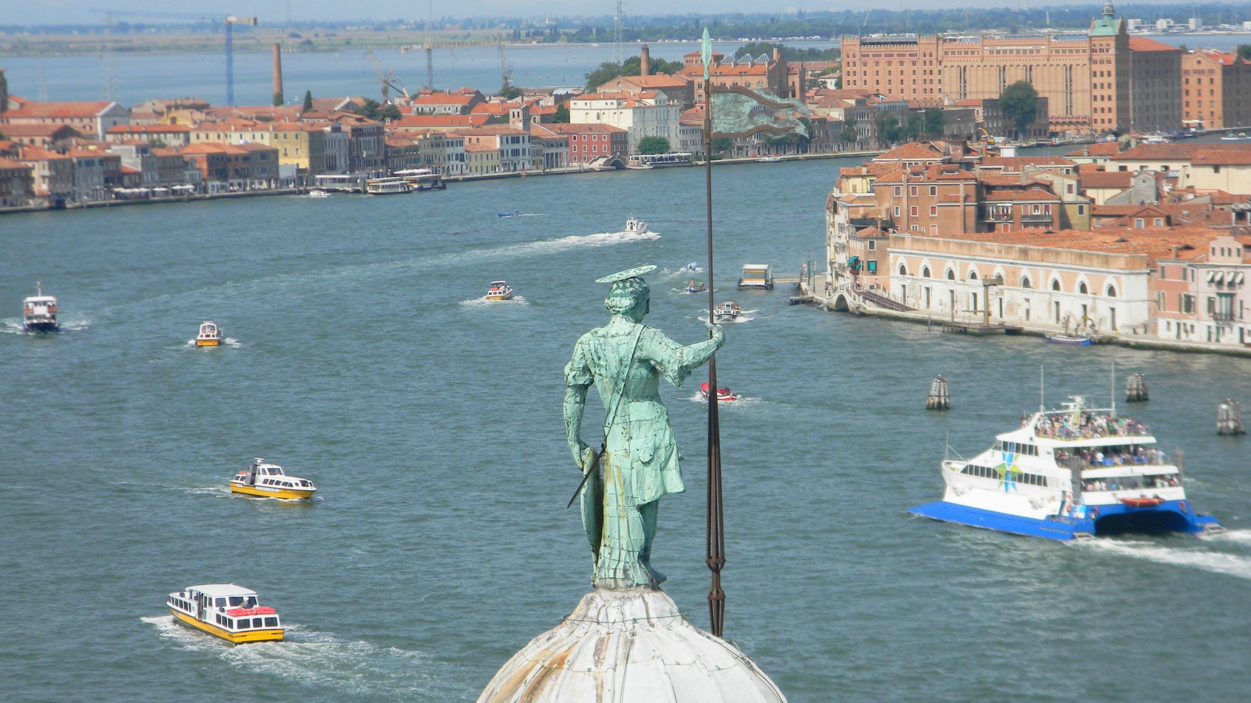 A Renaissance guardian watches over Venice's modern fleet. Photo by me.
