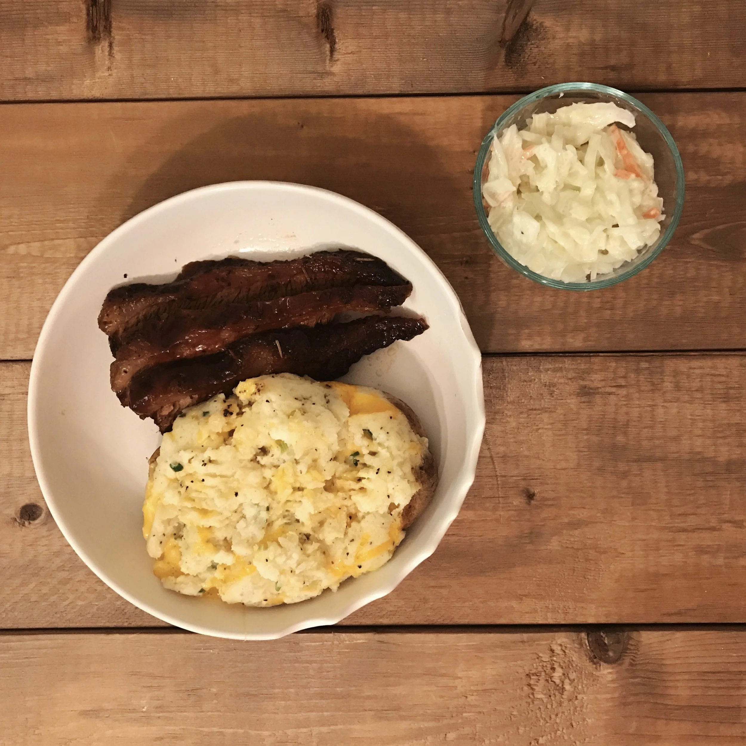 pictured: brisket, twice baked potato and coleslaw