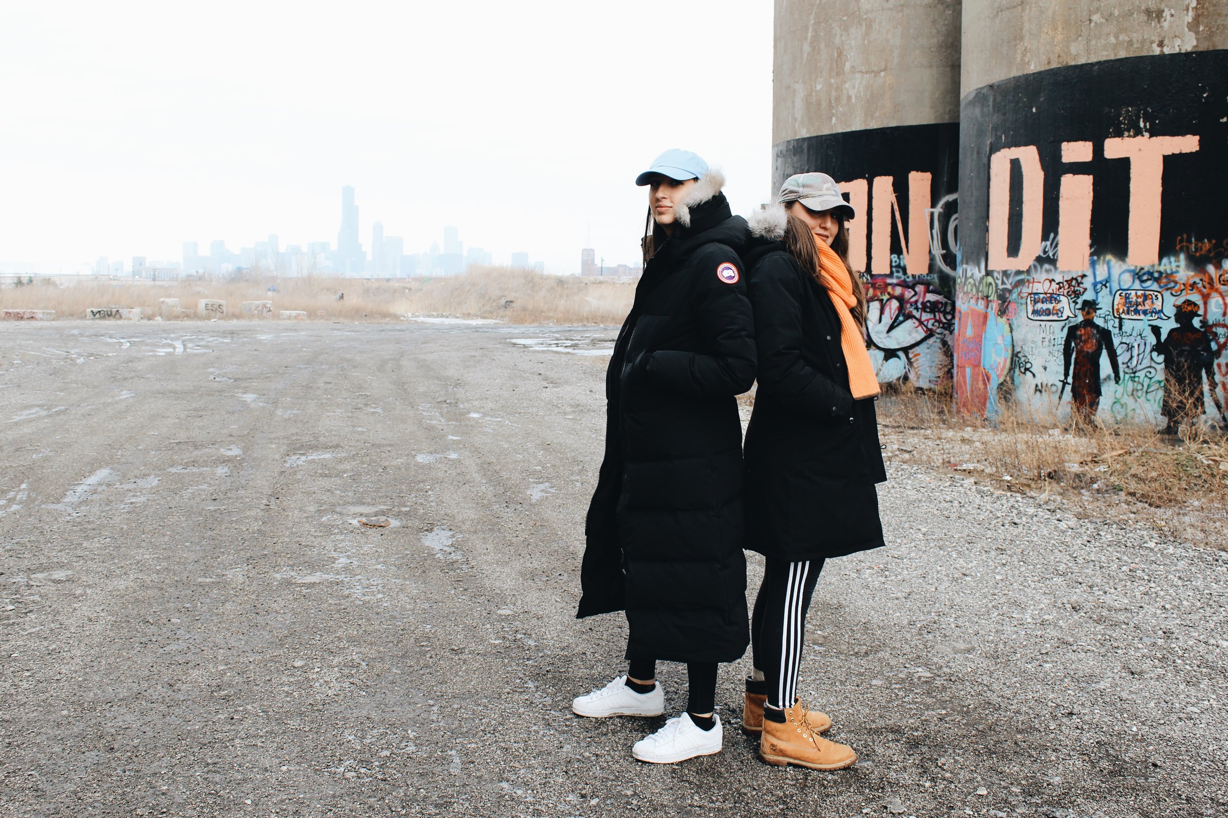  Amanda wears hat,&nbsp;Anti Social Social Club; coat, Canada Goose; leggings, Girlfriend Collective; sneakers, Adidas. Naomi wears hat, Topshop; scarf,&nbsp;Hermès; coat, Canada Goose; leggings, Adidas; boots, Timberland. 