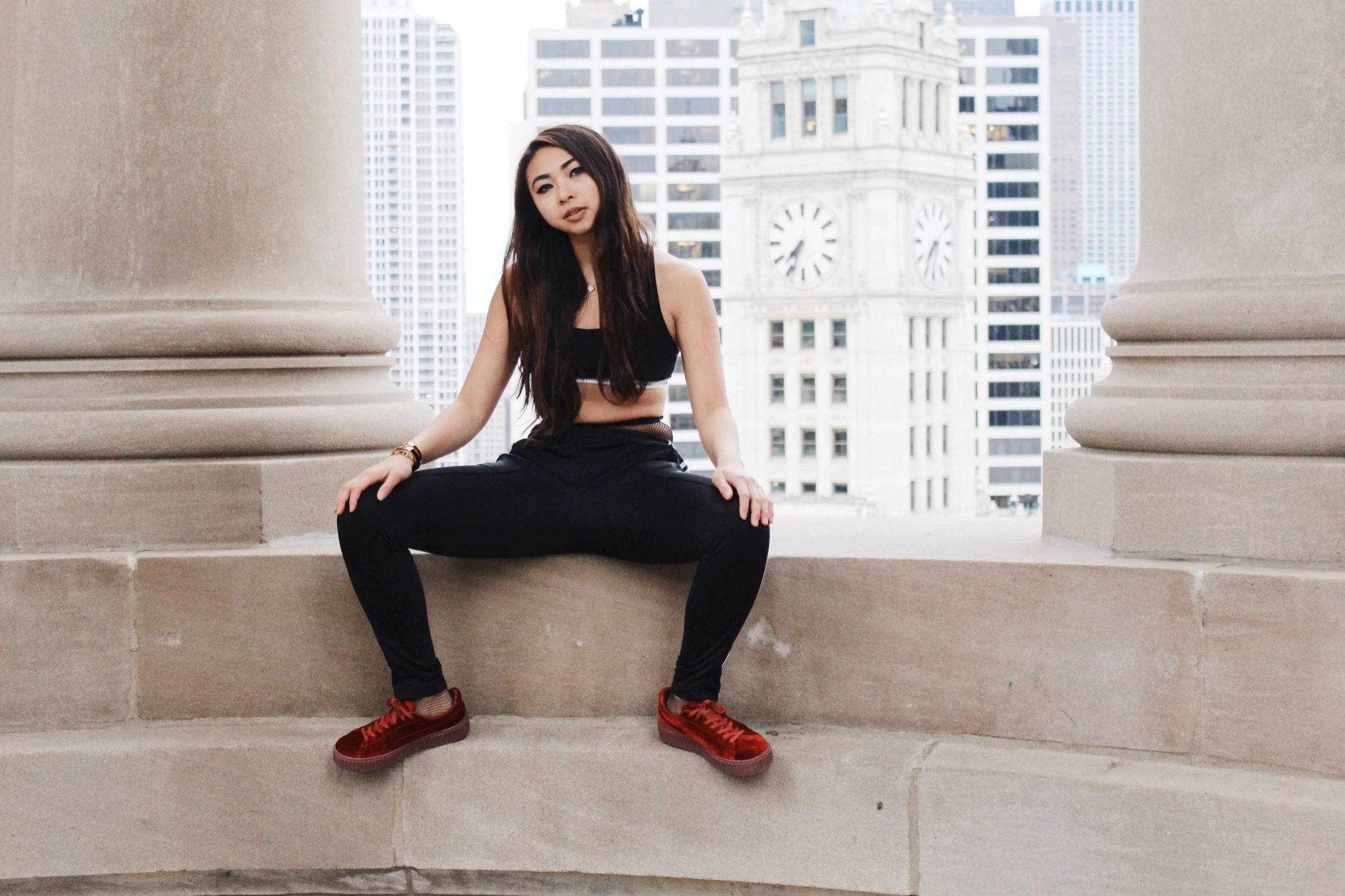 Ginger wears fishnet tights, Commando ; Superstar Track Pants, Adidas ; Velvet Creeper Sneakers; Fenty Puma .