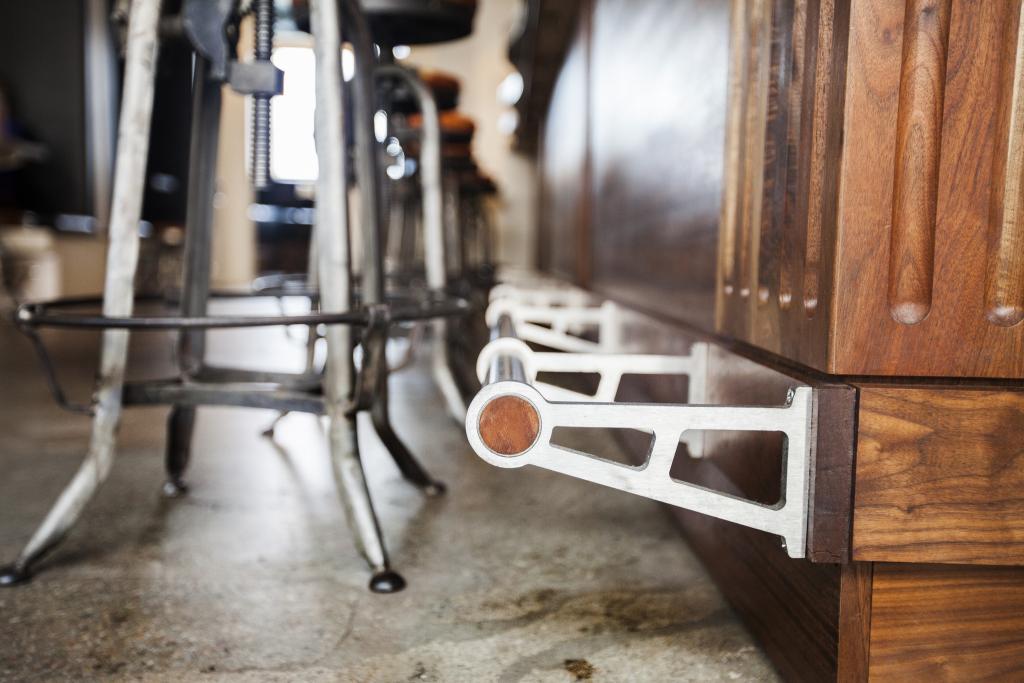  Specially sourced, locally-harvested California walnut hardwood and custom foot rail add to the beauty of this bar. 