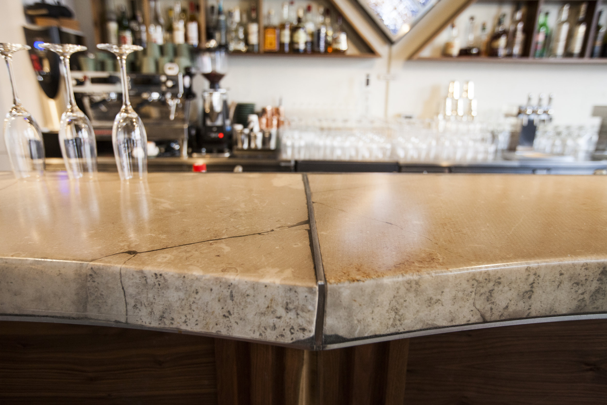 The bar top, a resin pour over slabs of sandstone, pieces saved from the Longnow Clock site in Texas. 